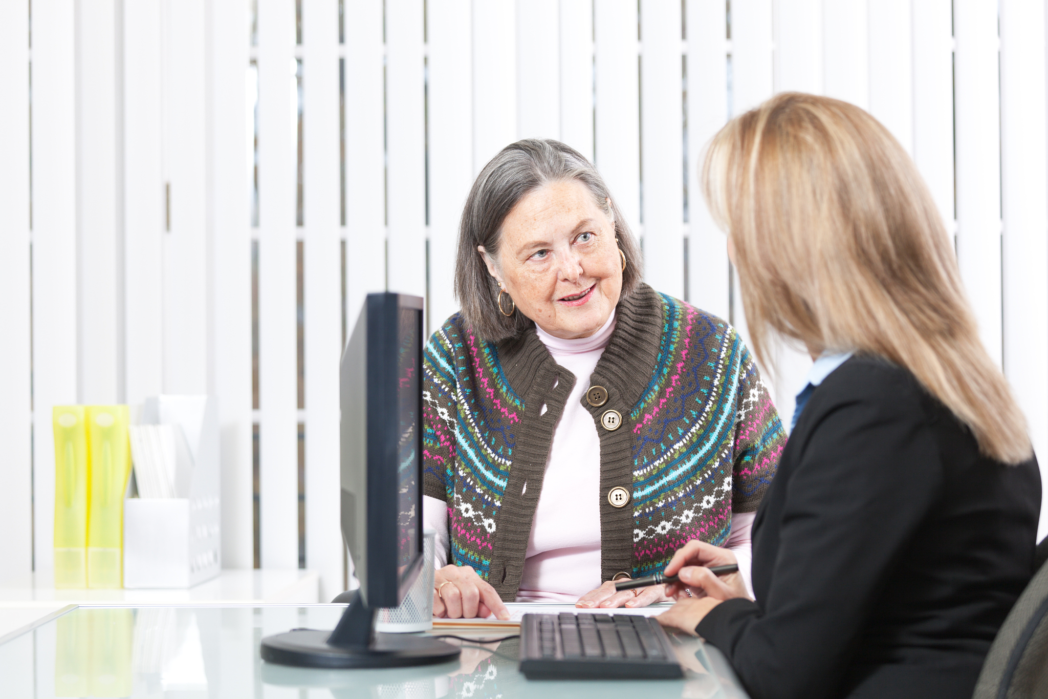 senior woman talking to banking and financial advisor hz