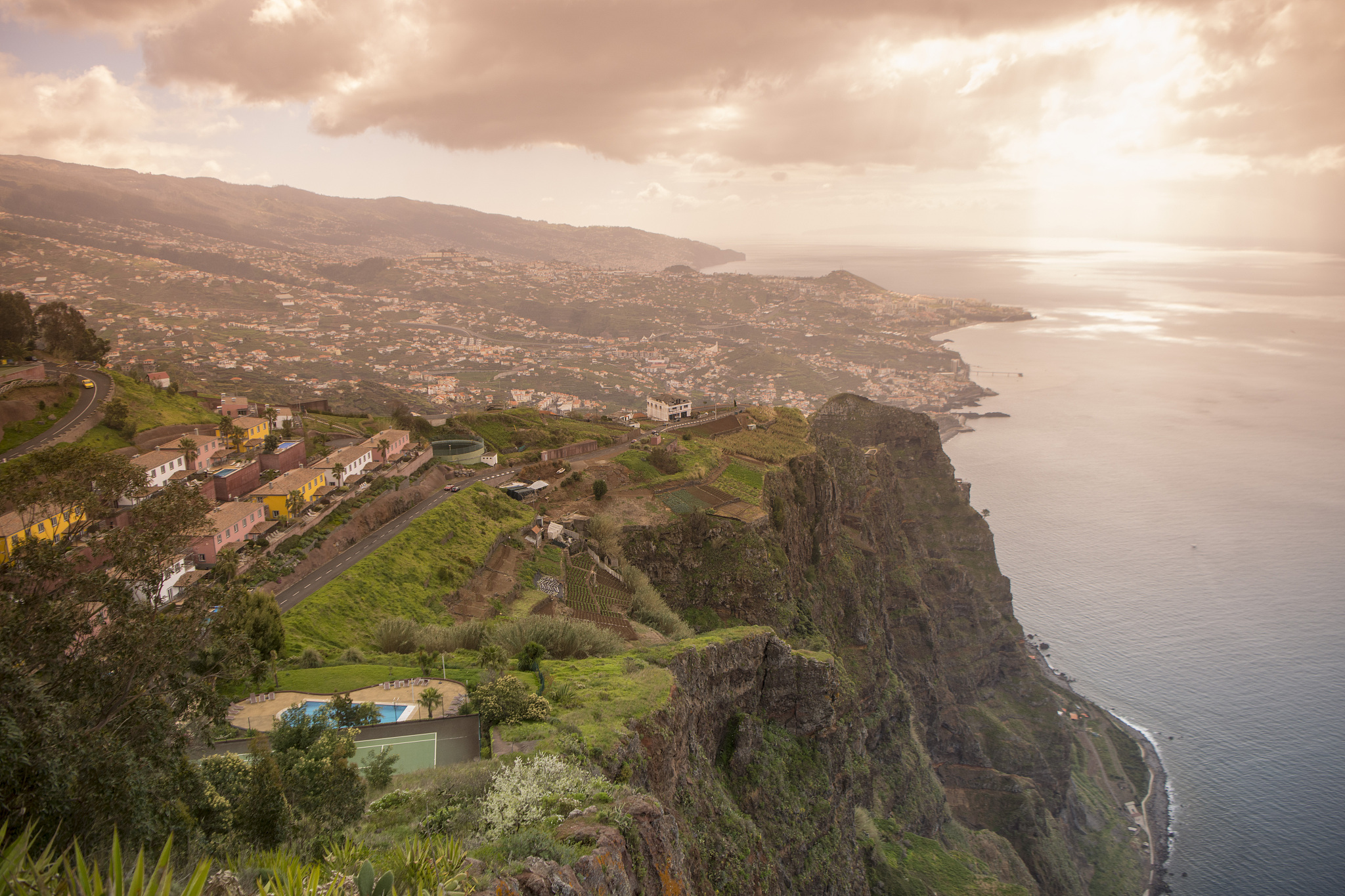 high angle view of sea and mountains against sky
