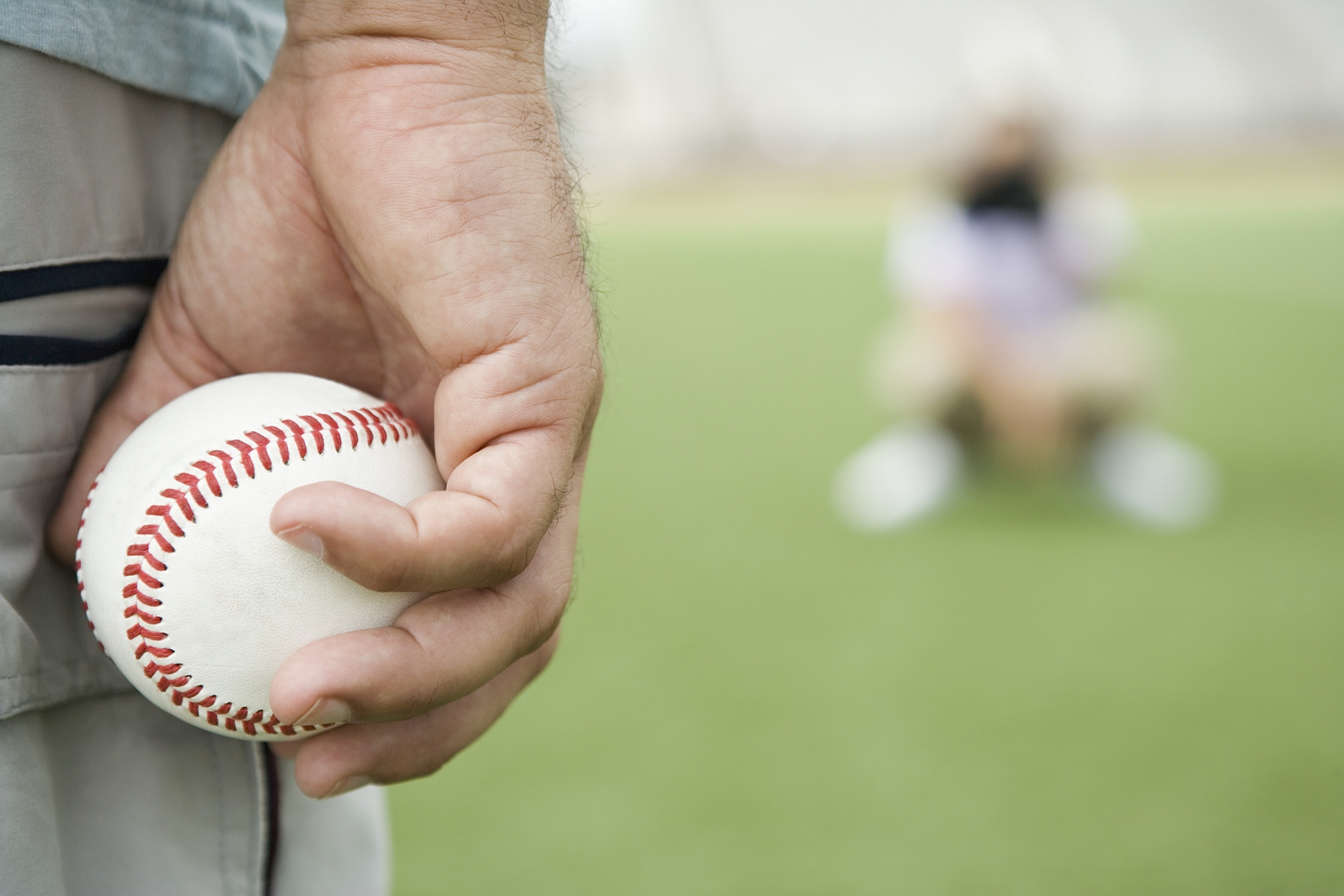 man holding baseball