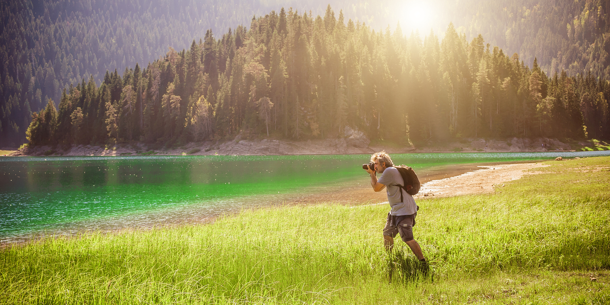 professional photographer take picture of landscape at the mount