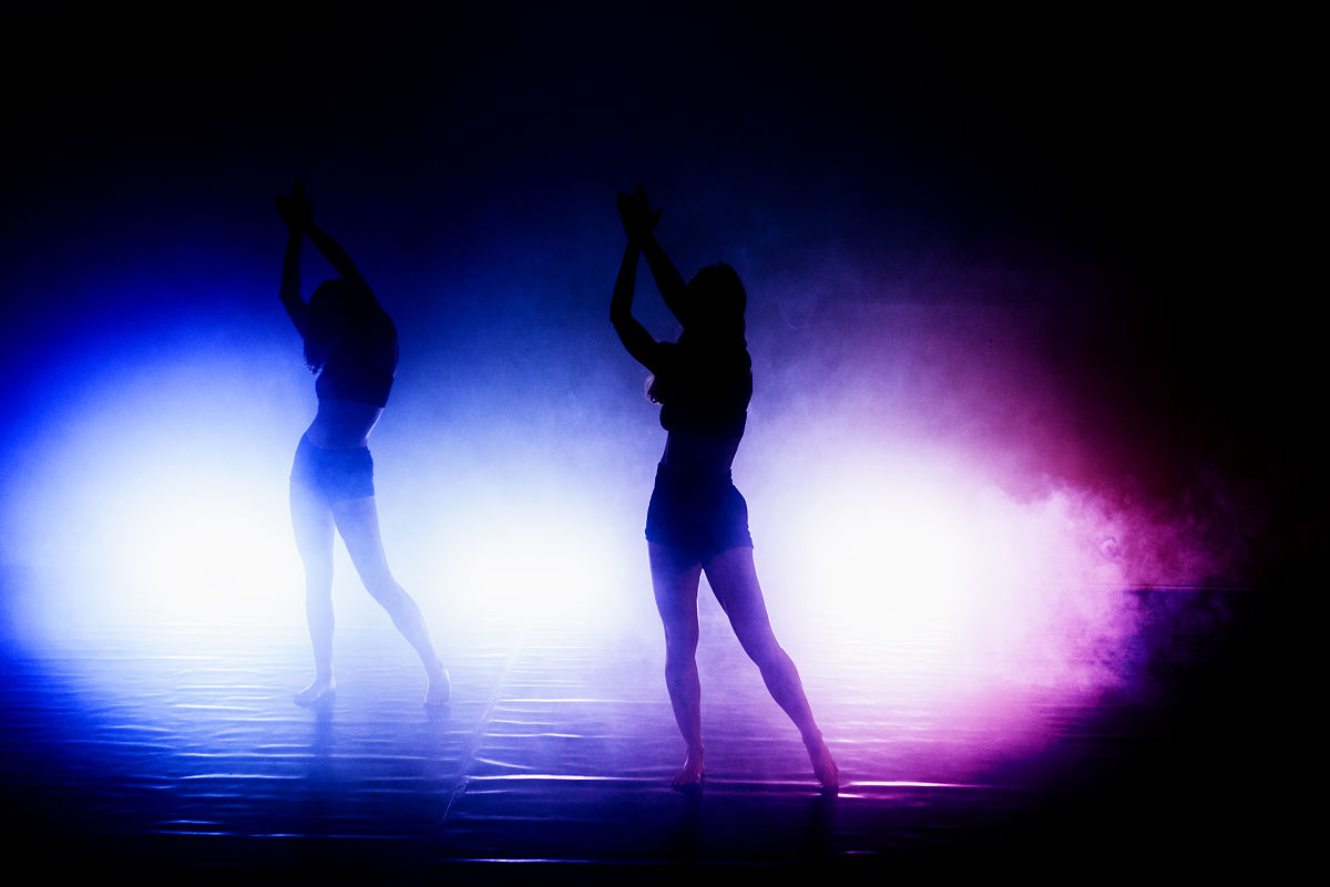 correct As depicted in the picture there are several vivacious ladies dancing intently on the stage And there are many inquisitive audiance are watching them