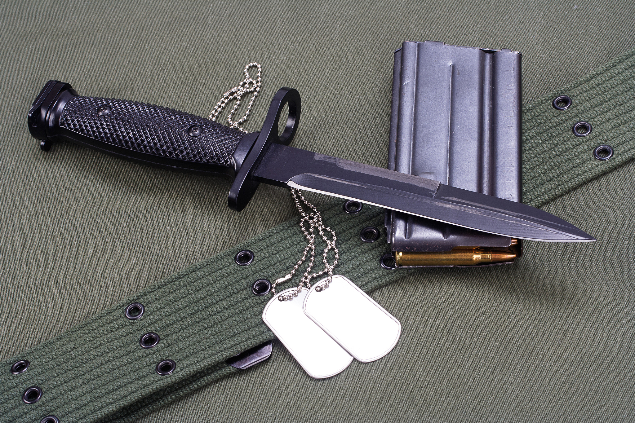 m16 rifle bayonet on uniform background