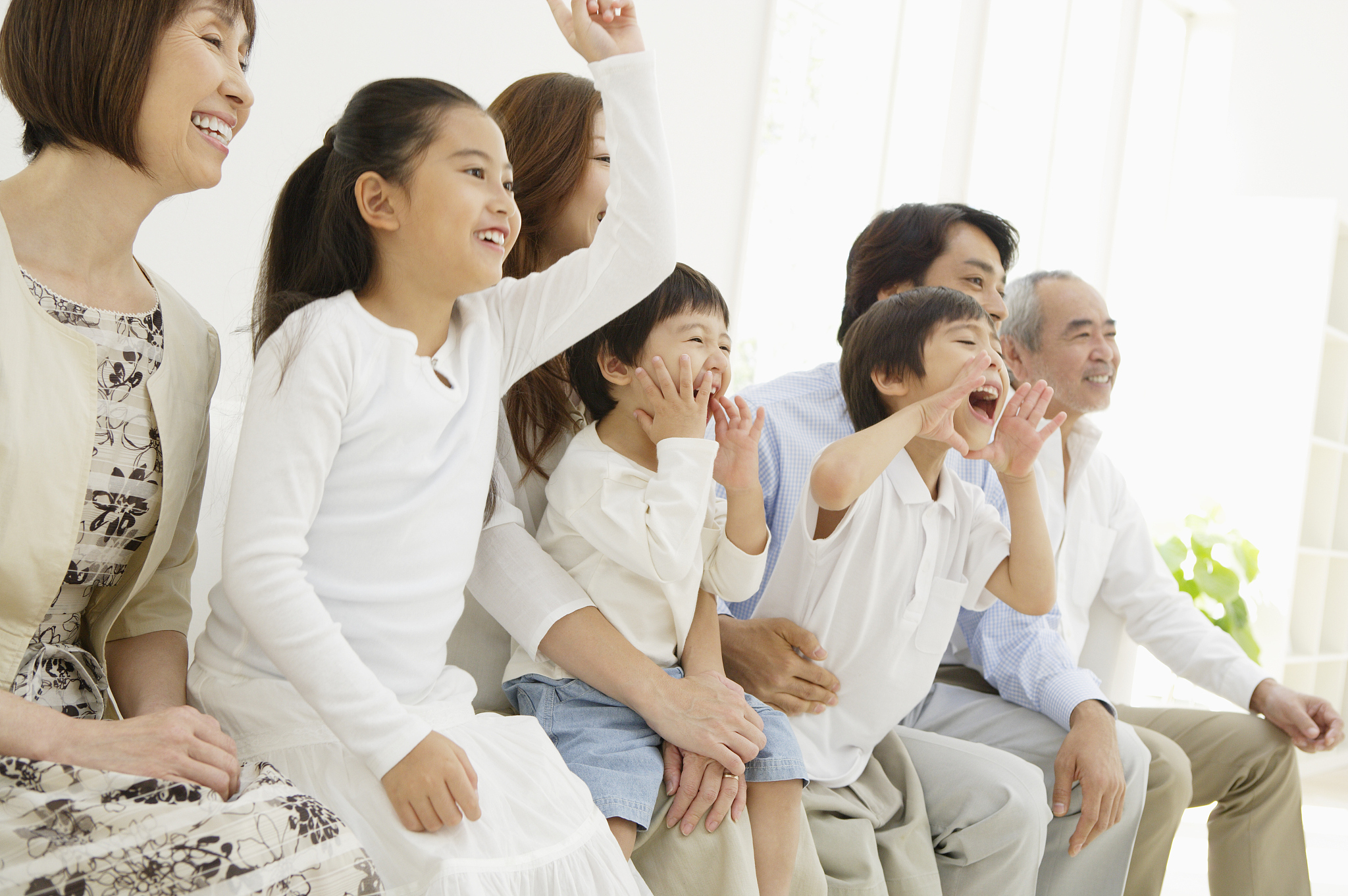 multi-generation family watching tv