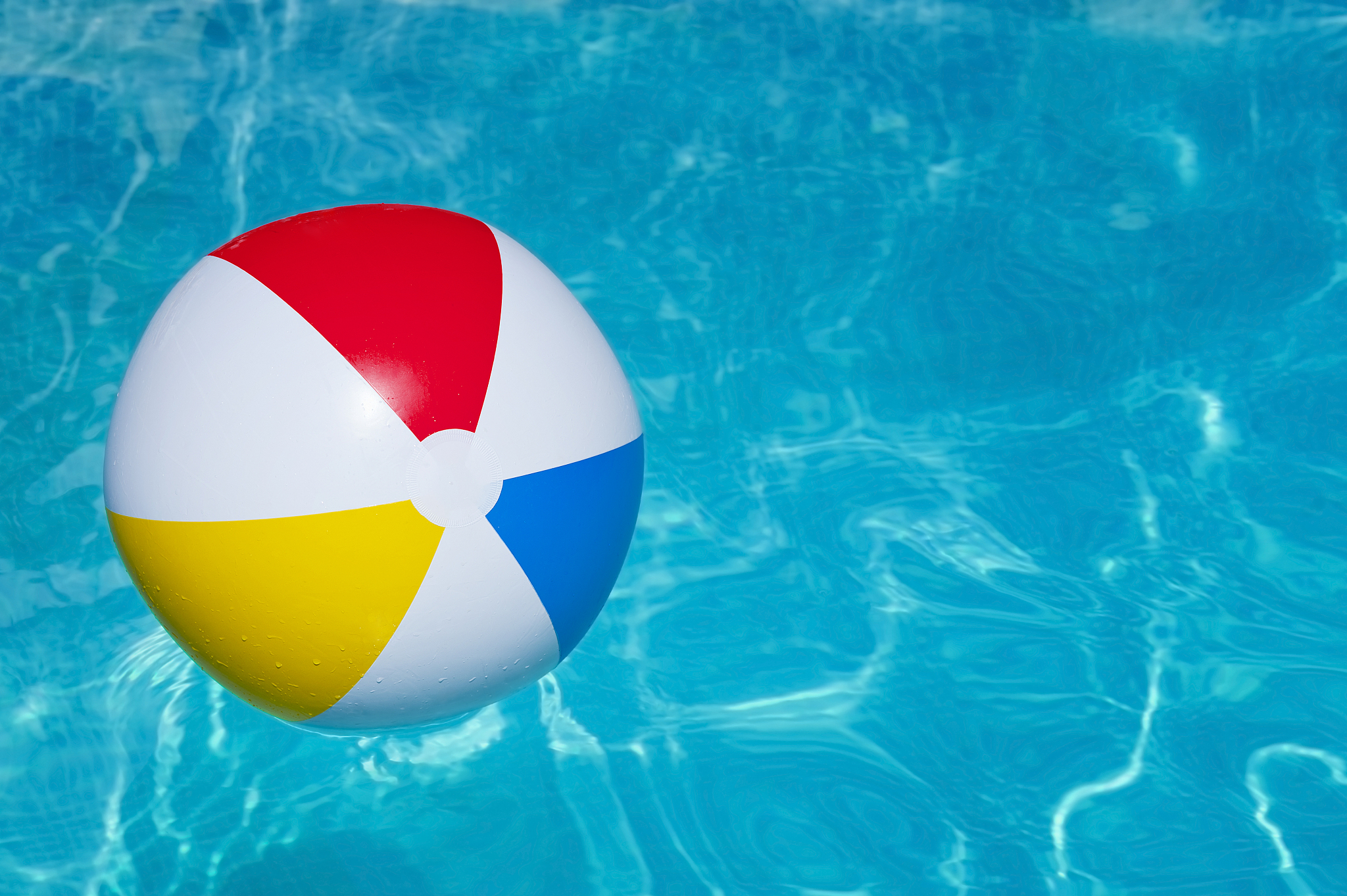 colorful inflatable ball floating in swimming pool
