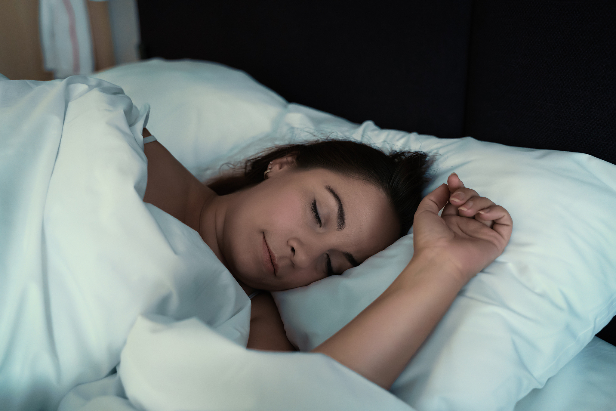 young attractive woman sleep in bed at home, close up face portr
