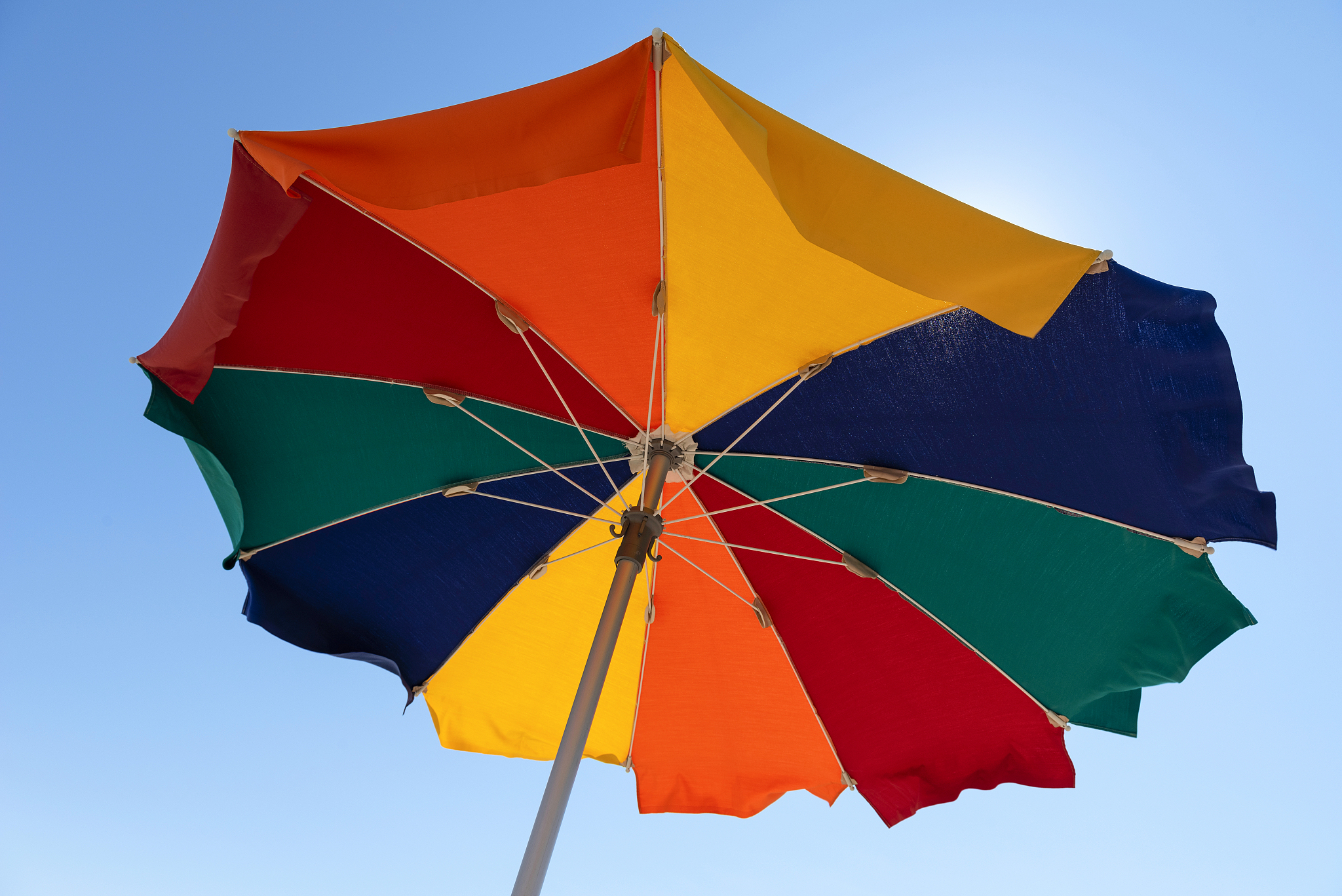bright colorful beach umbrella against the blue sky. beach vacat