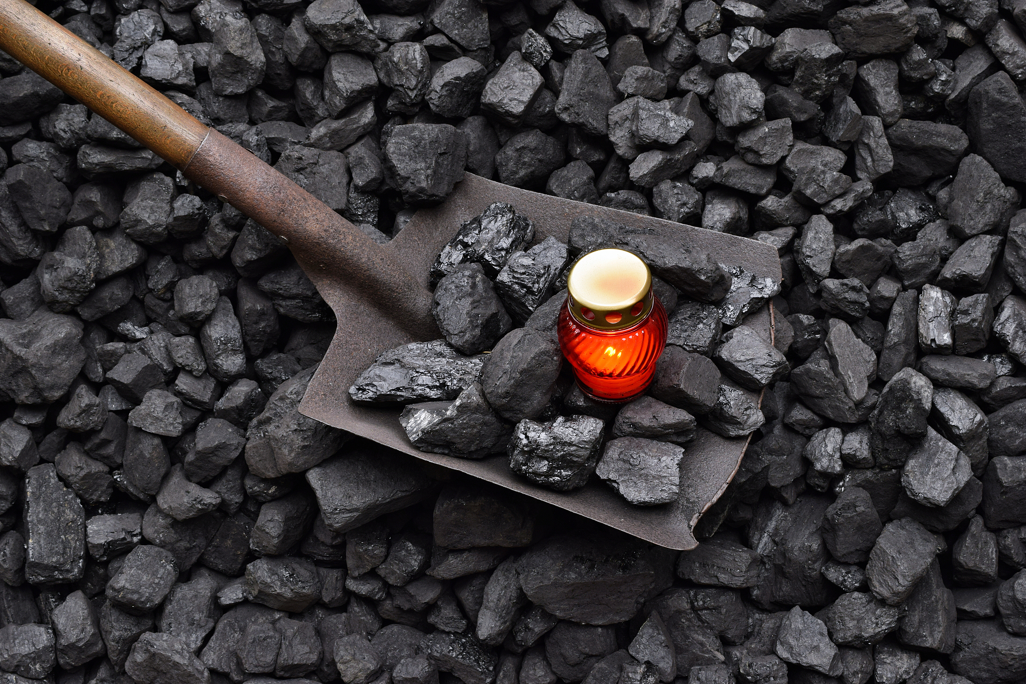 vigil light, candle with the miner shovel