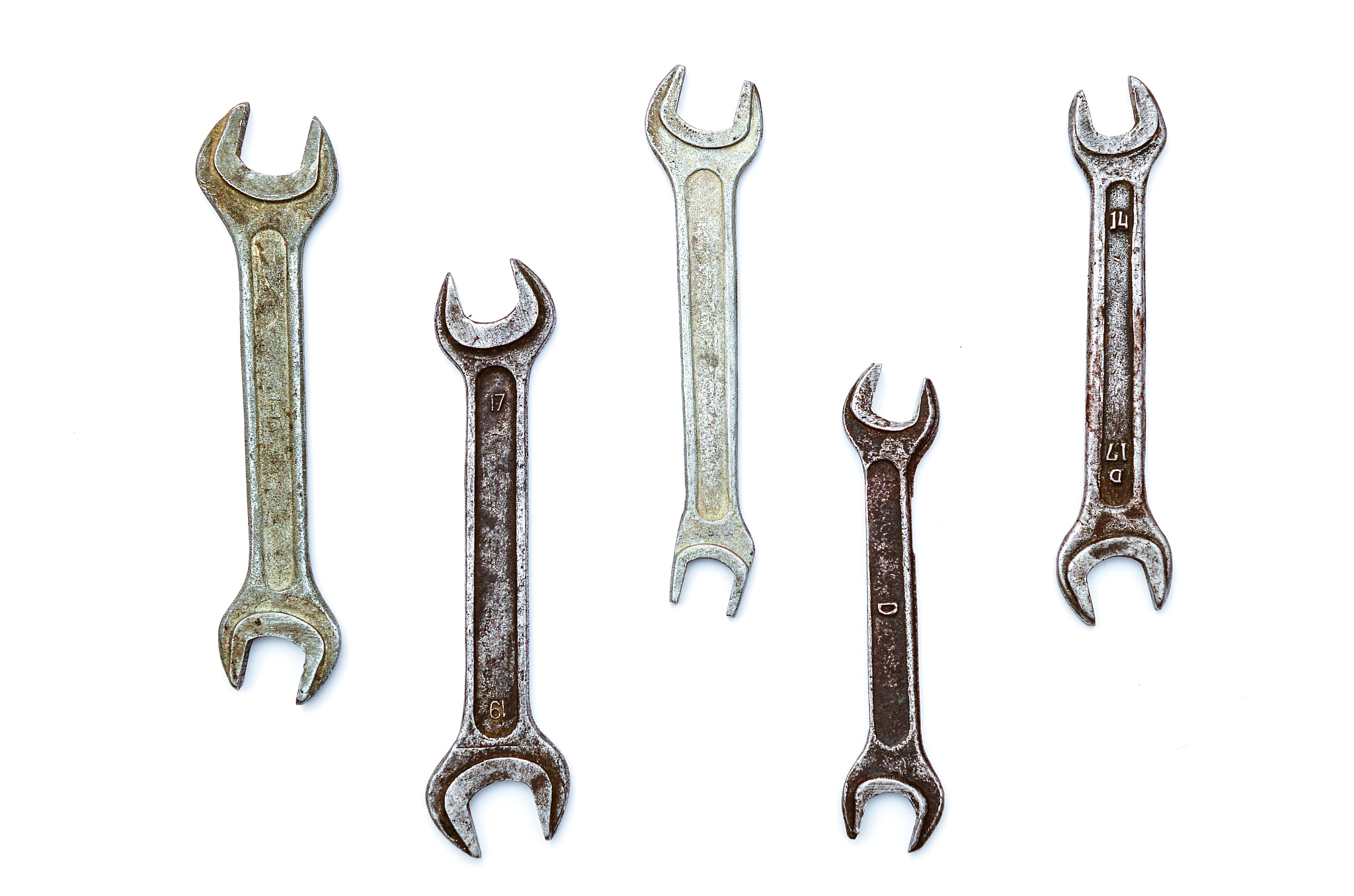 set of old wrenches on a white background
