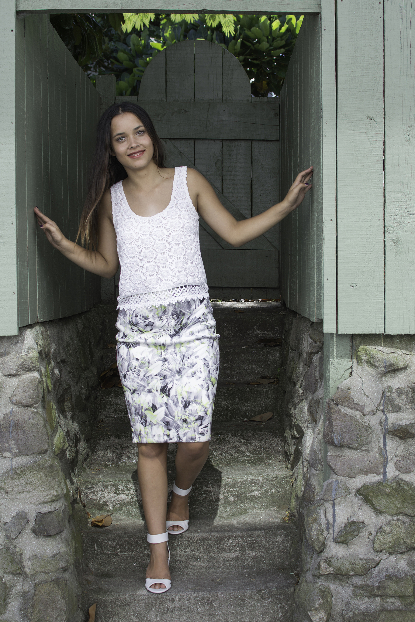 beautiful smiling young woman on stone steps