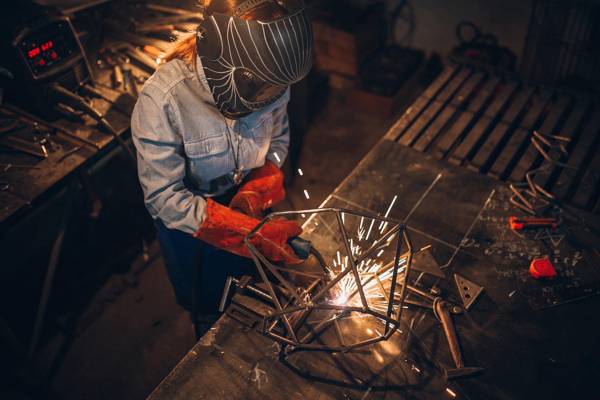 woman using a welding machine