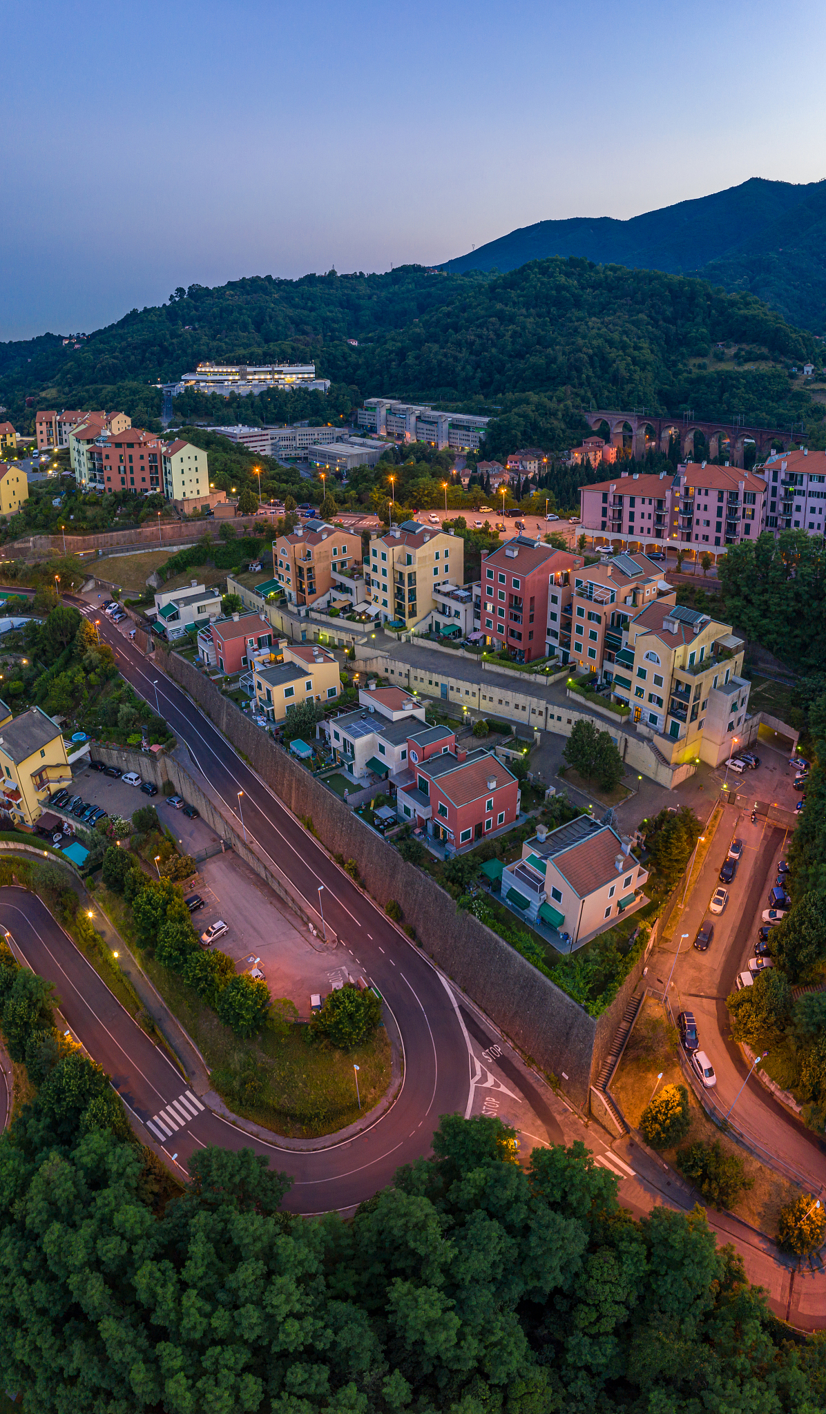 vertical photo of genoa city townscape view with colorful houses
