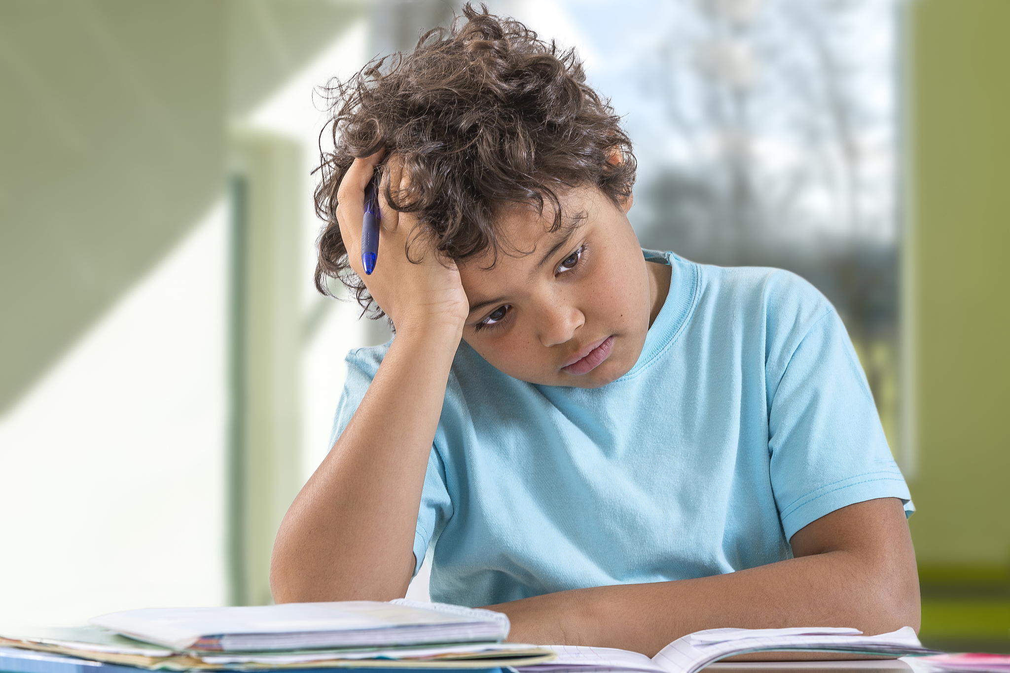 boy doing homework.