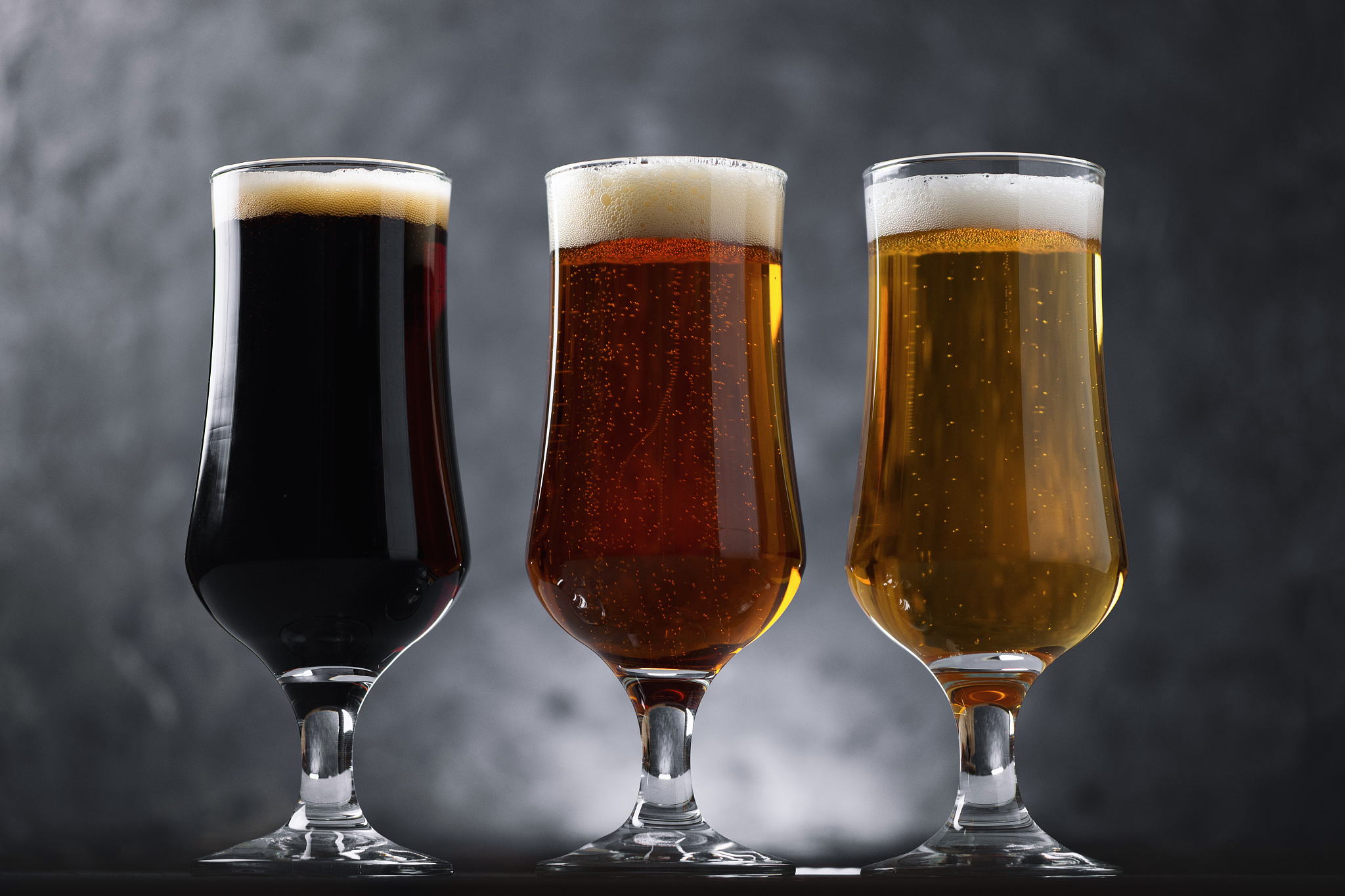 choose from three different types of craft beer in glasses on a 