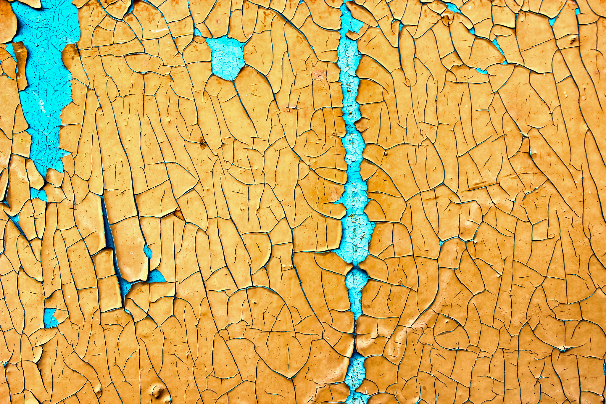 old peeling paint on the board. blue and orange background.