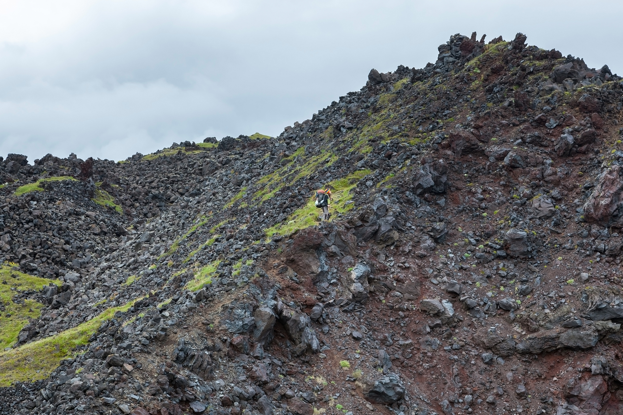 snaefellsness, iceland - july 23, 2016. young woman with big bac