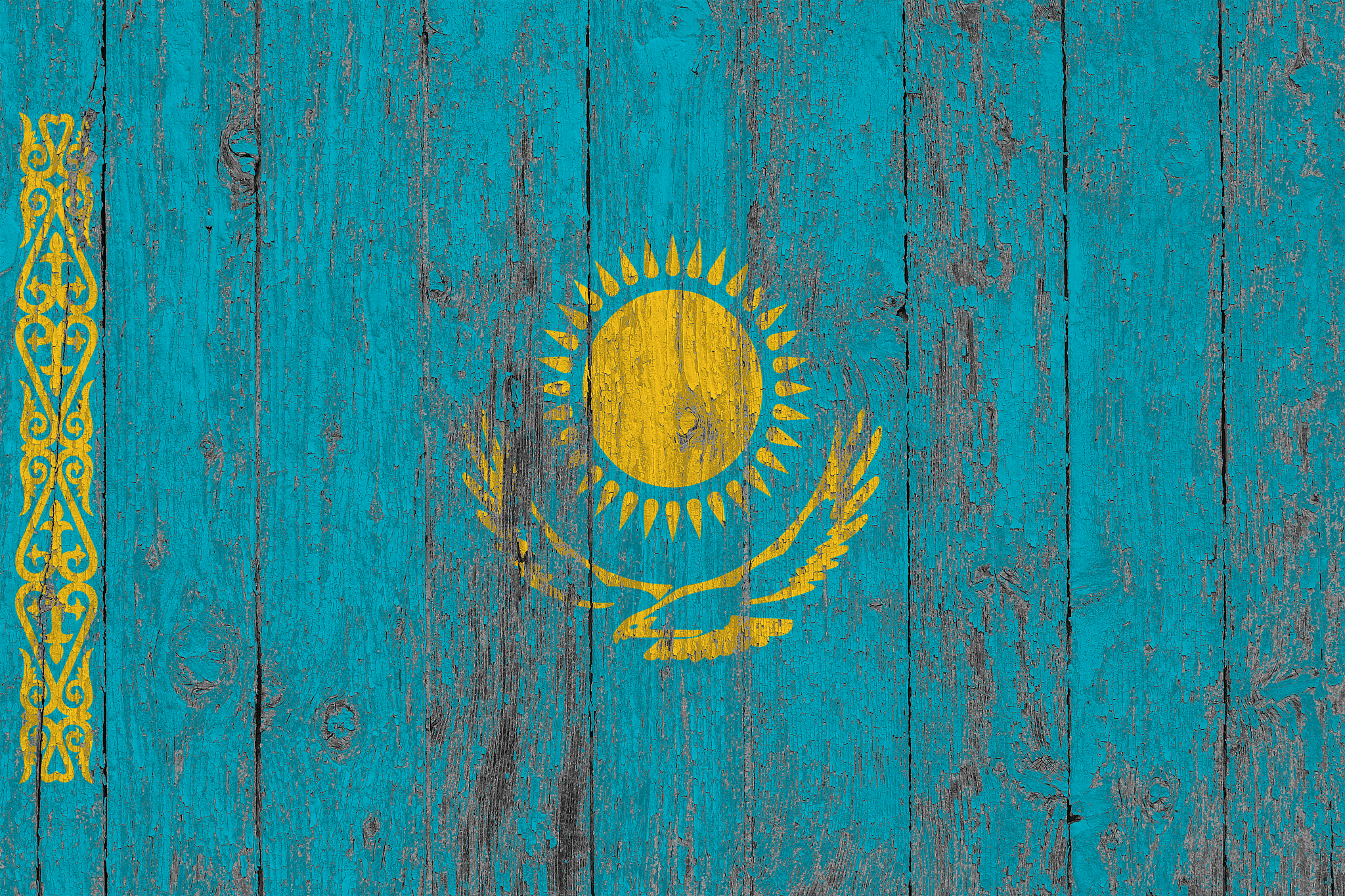 flag of kazakhstan painted on worn out wooden texture background