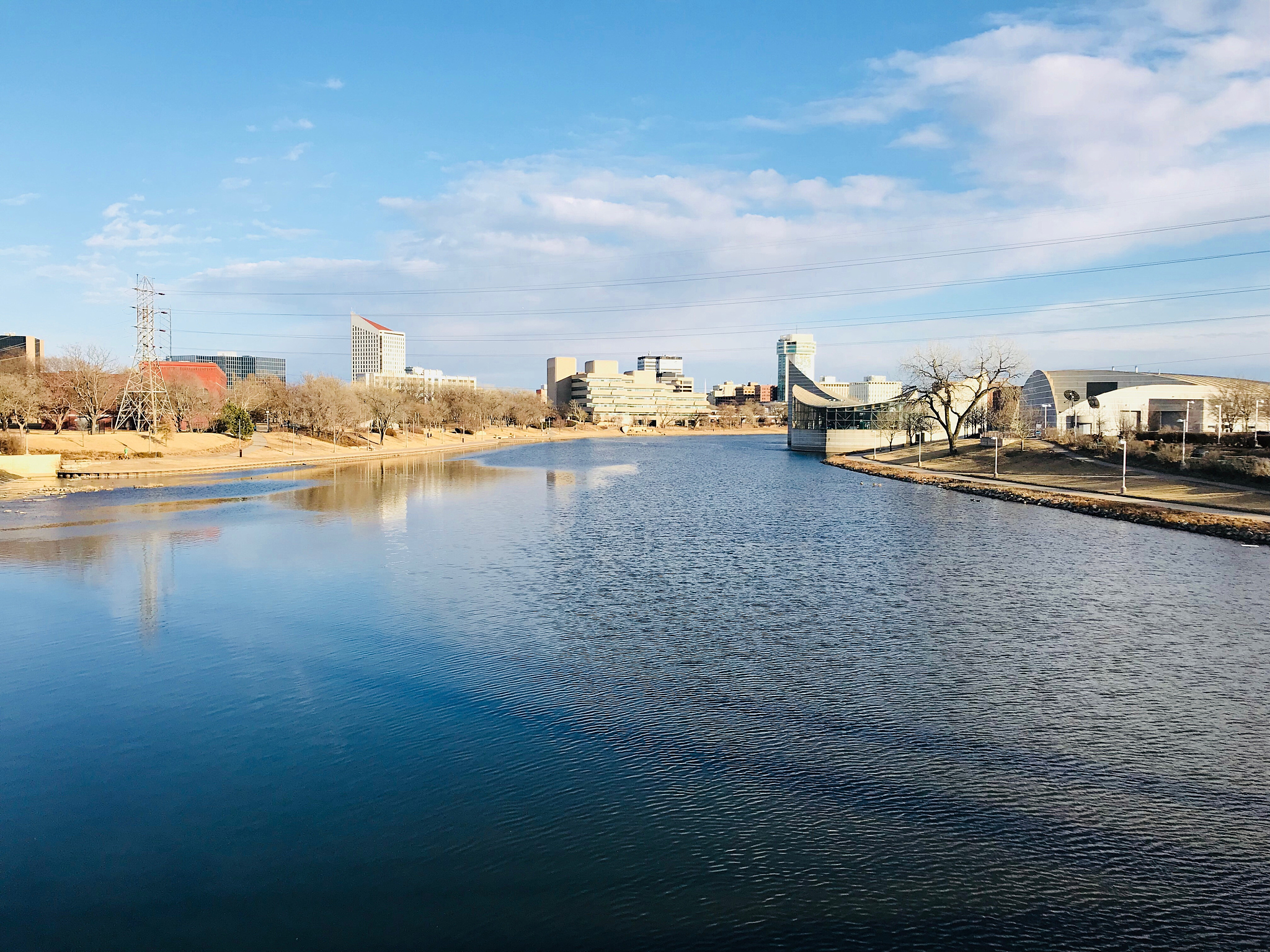 view of river and cityscape against sky
