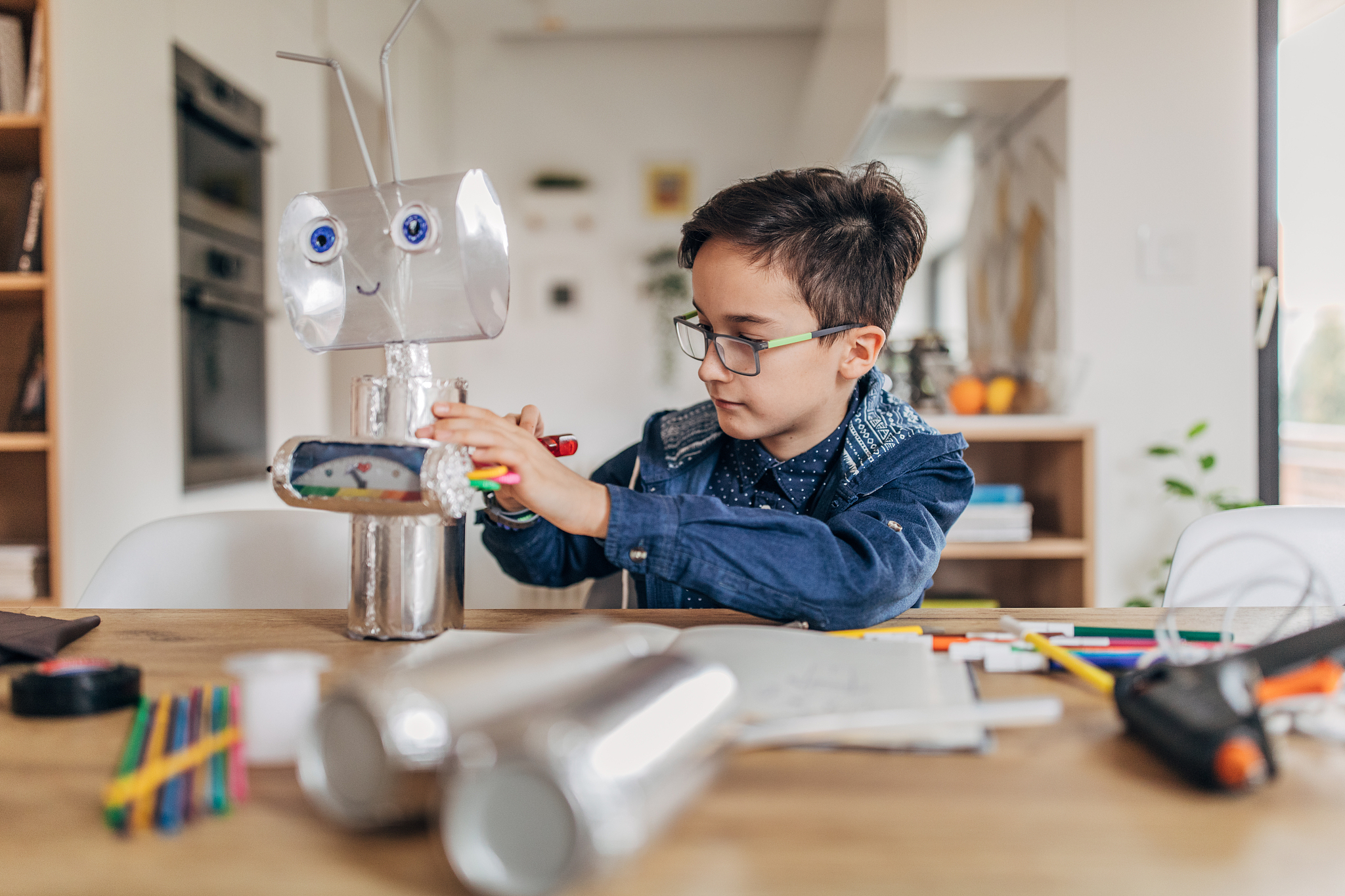 boy making a robot for school science project
