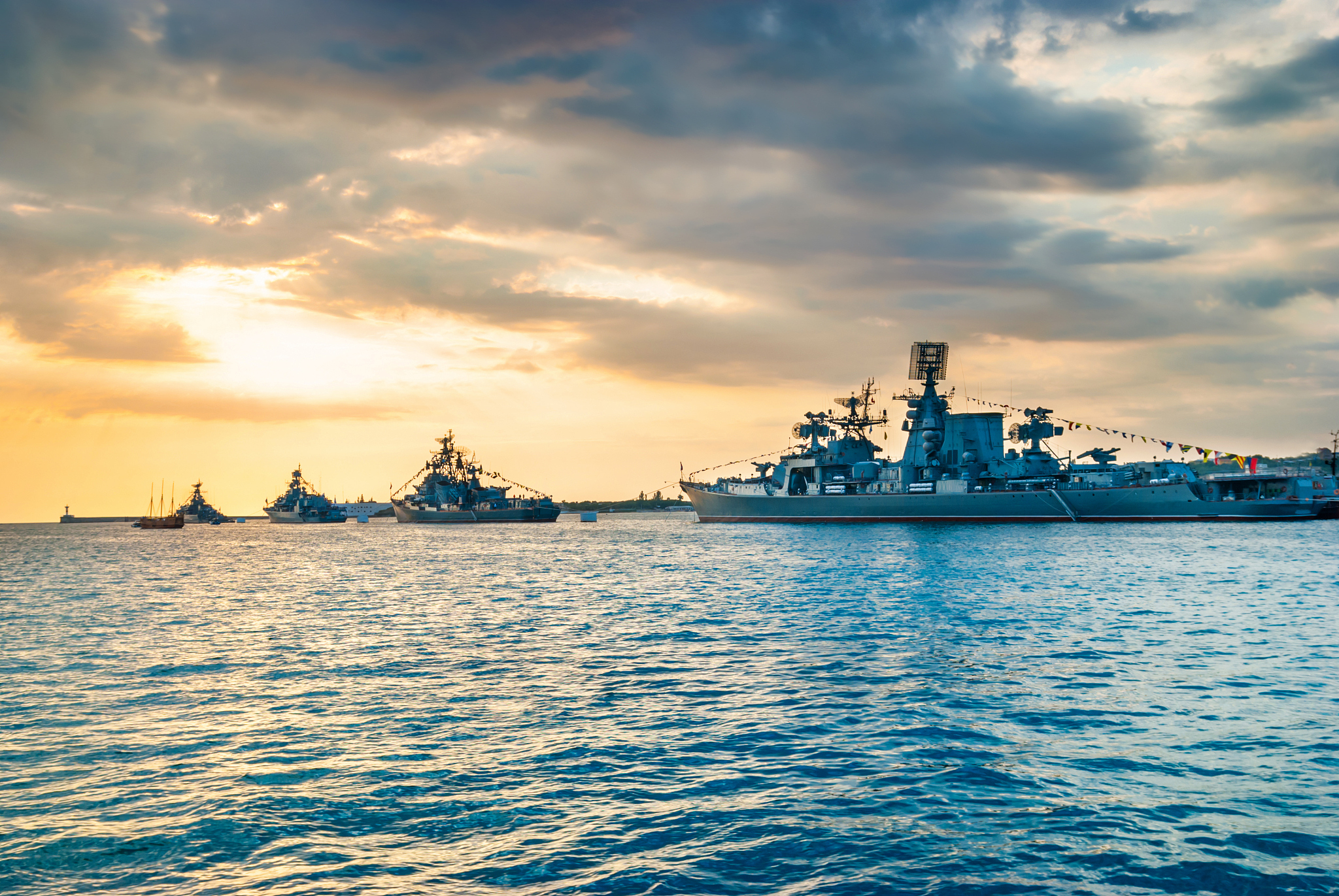 military navy ships in a sea bay