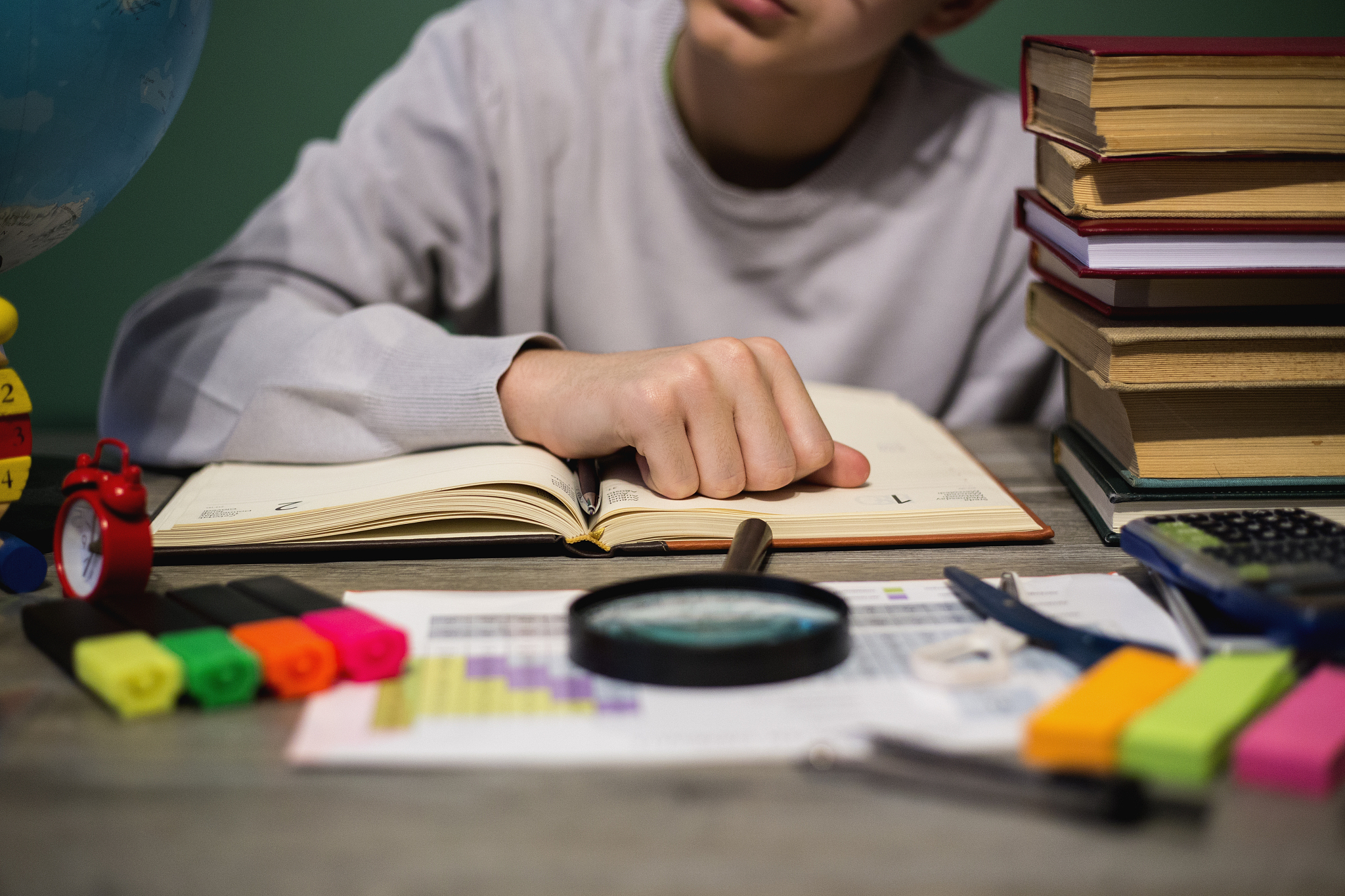 hand of a boy on a book
