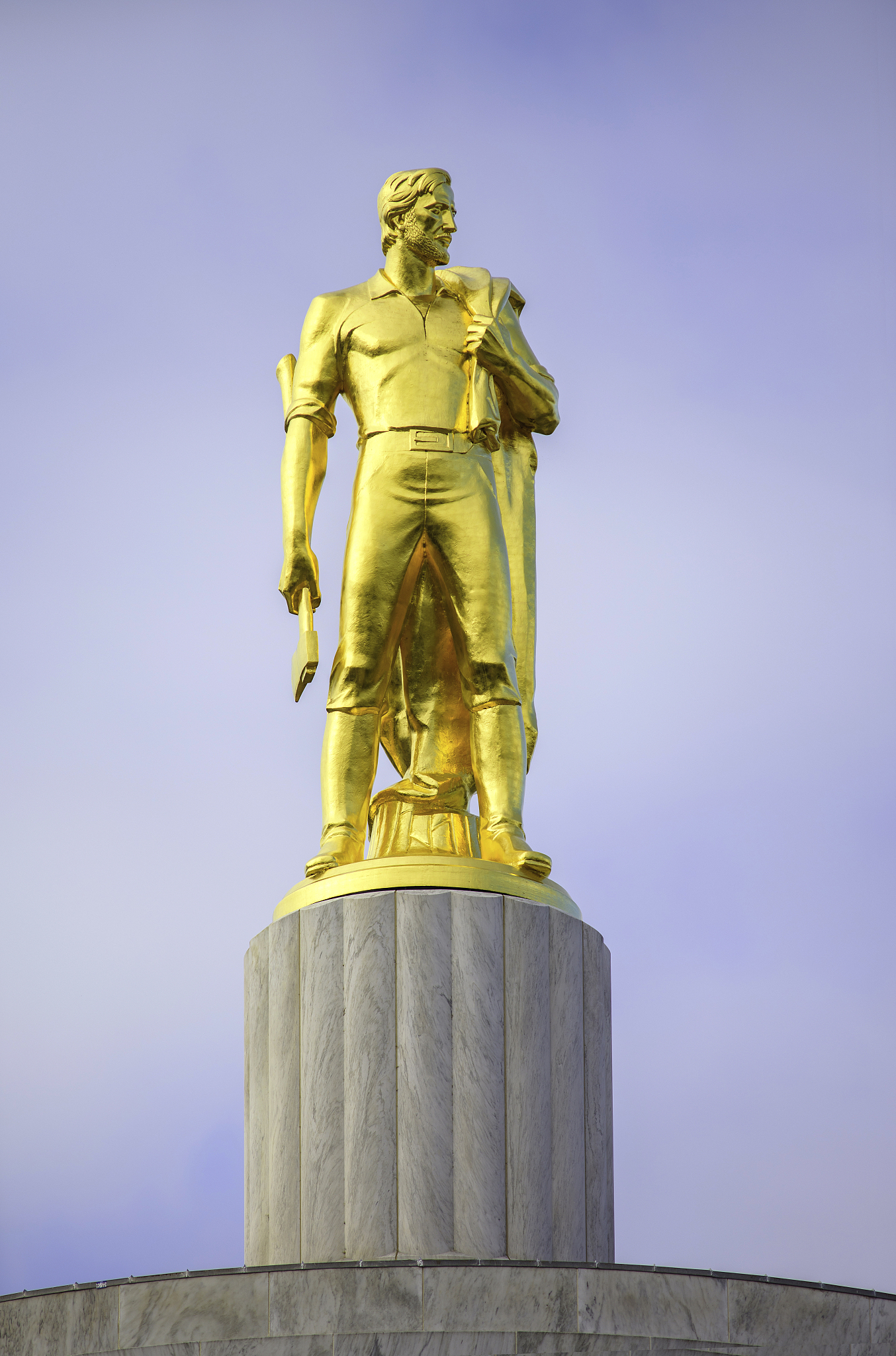 gold man on top of state capital building