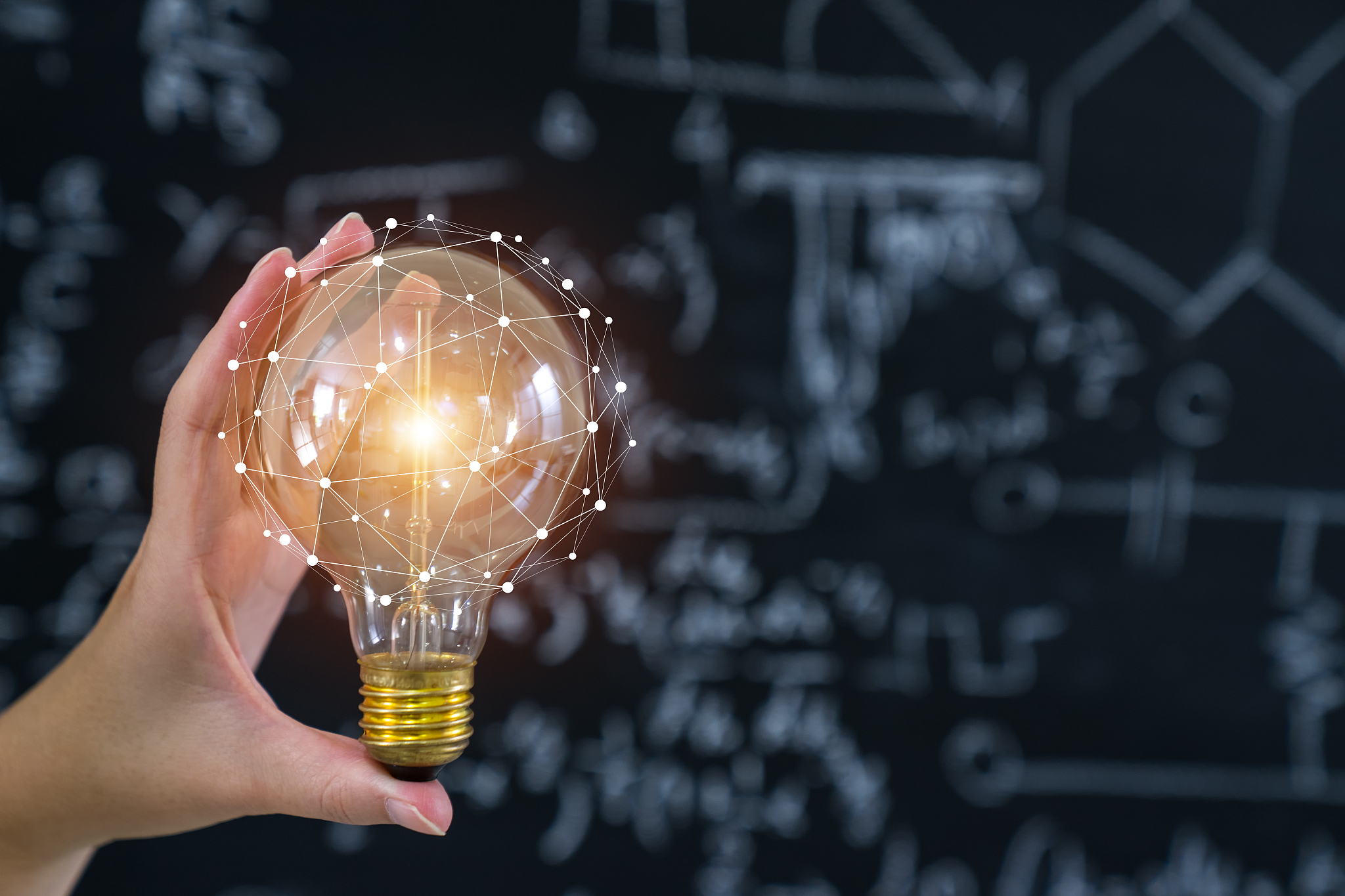 hand holding light bulb concept and education.
