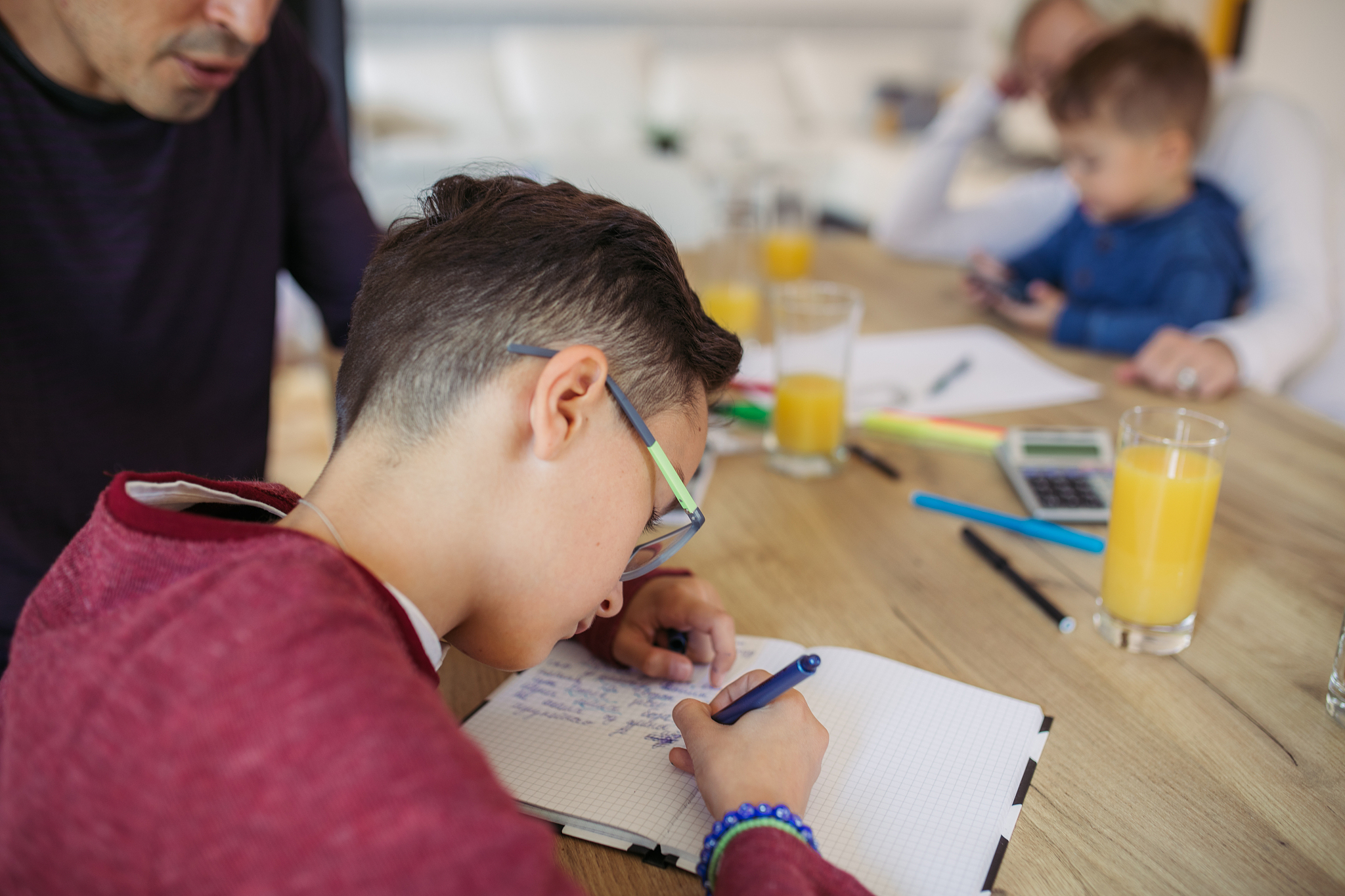 father and son doing homework