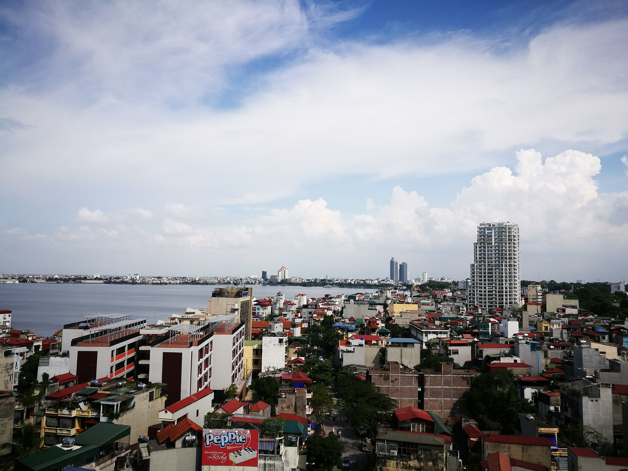 cityscape by sea against sky