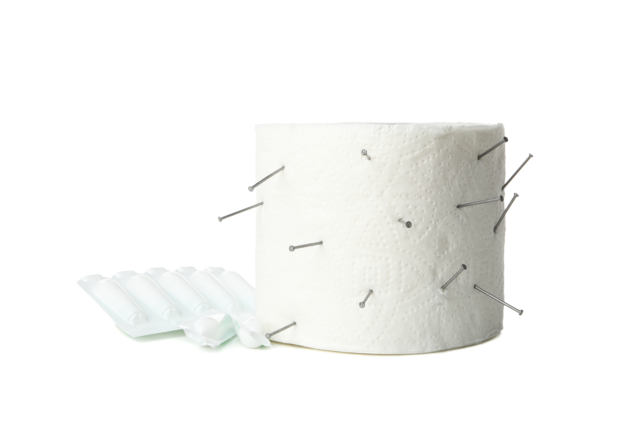 toilet paper with nails and candles isolated on white background