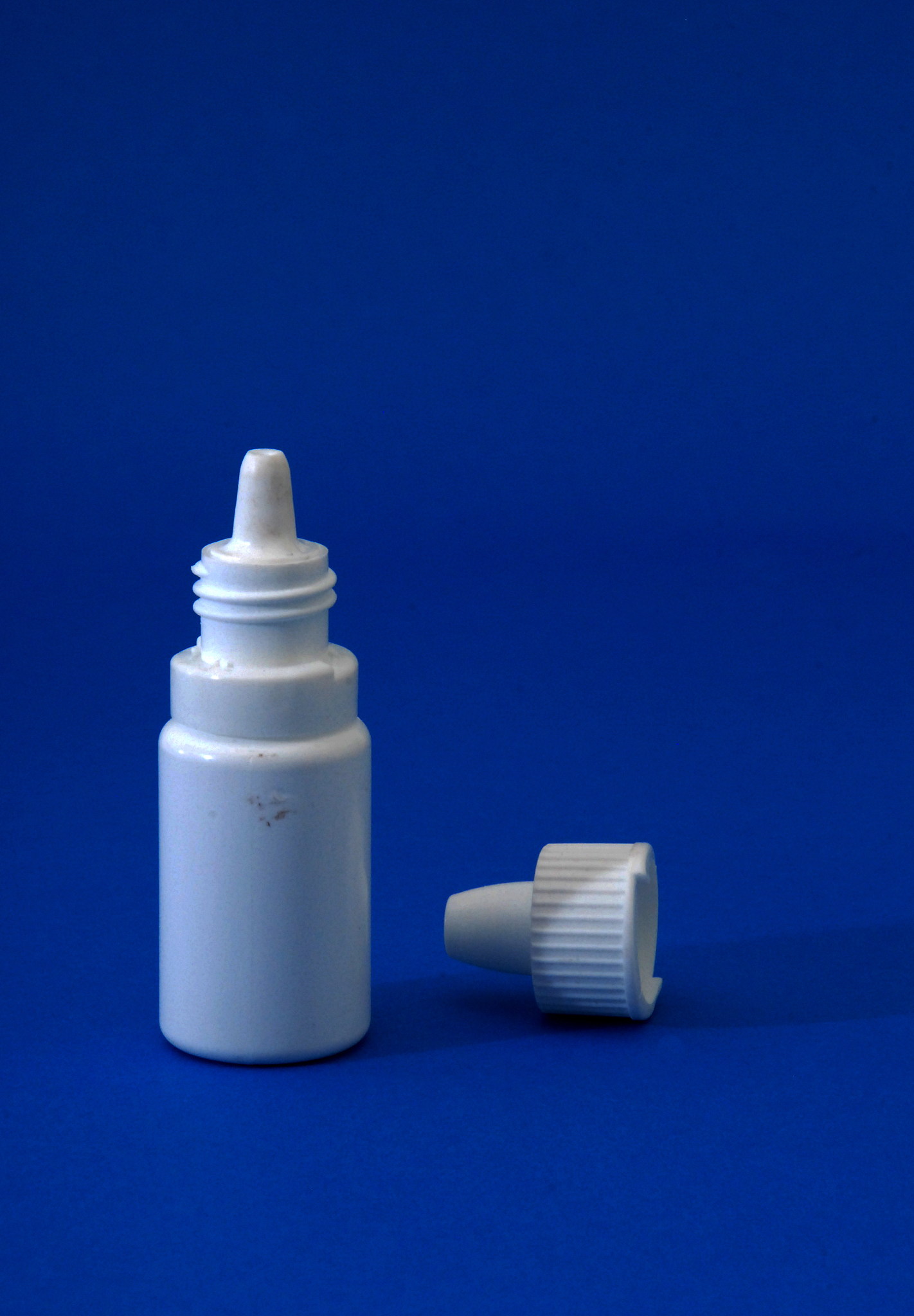 close-up of bottle on blue background