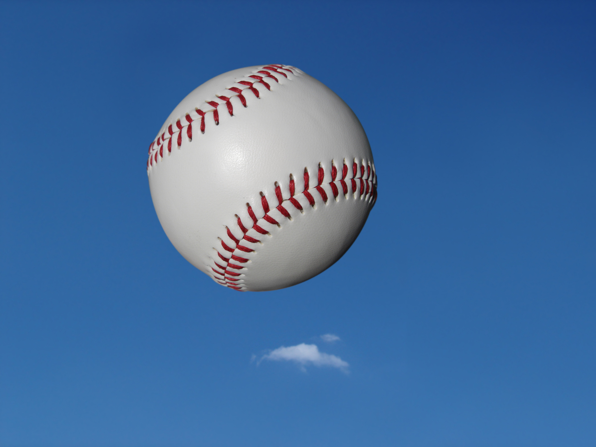 new baseball in air