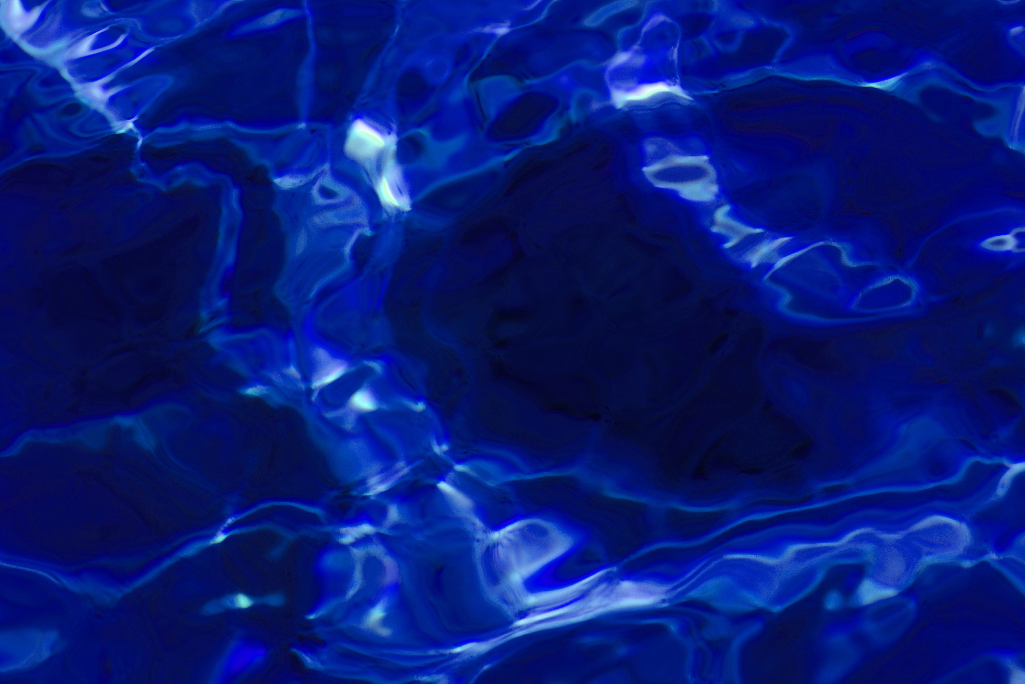 blue abstract background of wavy water surface