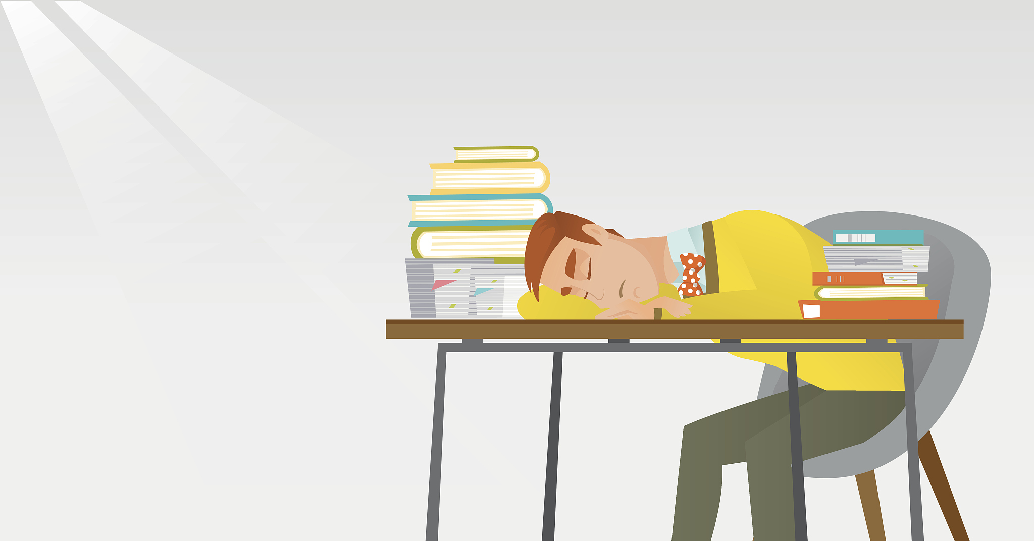student sleeping at the desk with book