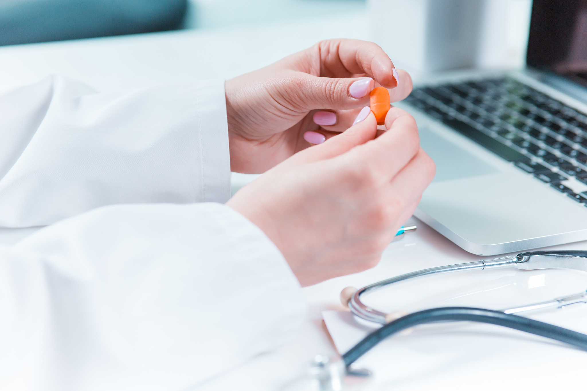 the doctor hands with pill in hospital