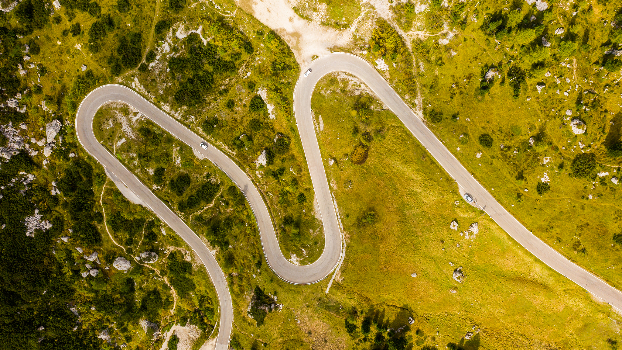 aerial view of winding road, dolomites, italy