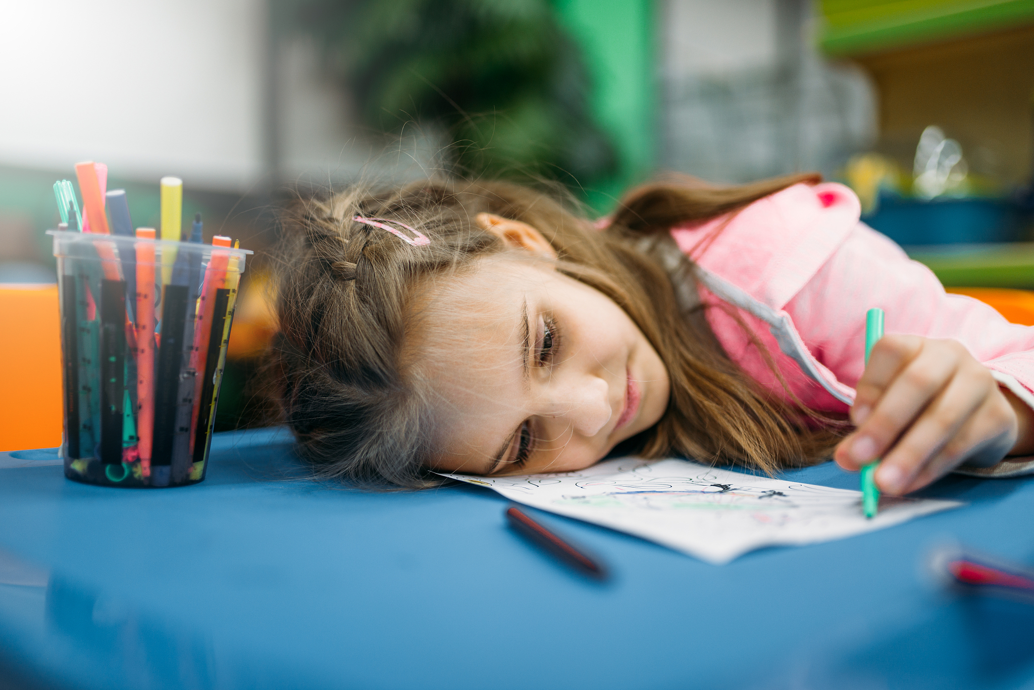 little girl asleep on playground