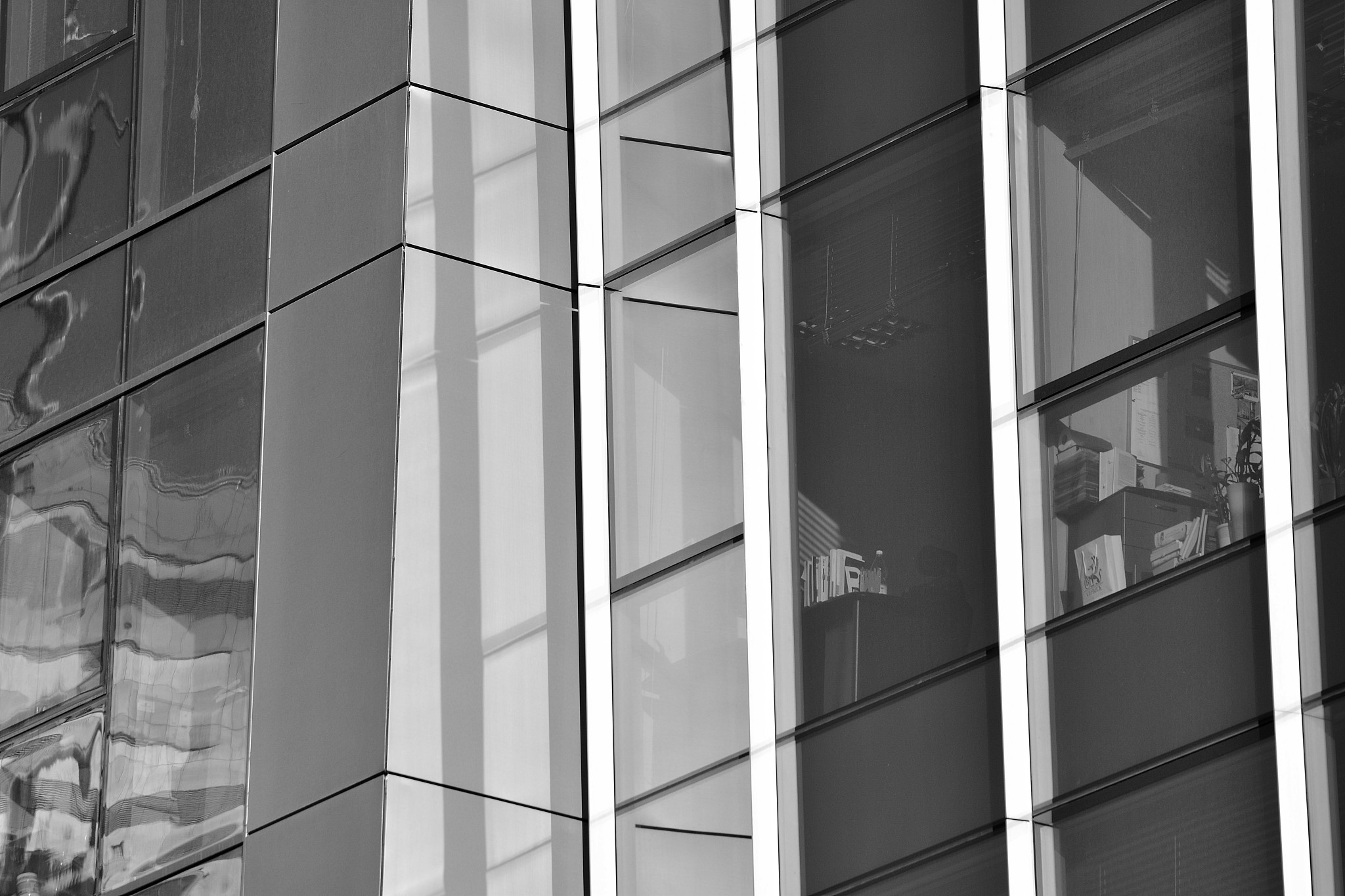 modern office building wall made of steel and glass. black and w