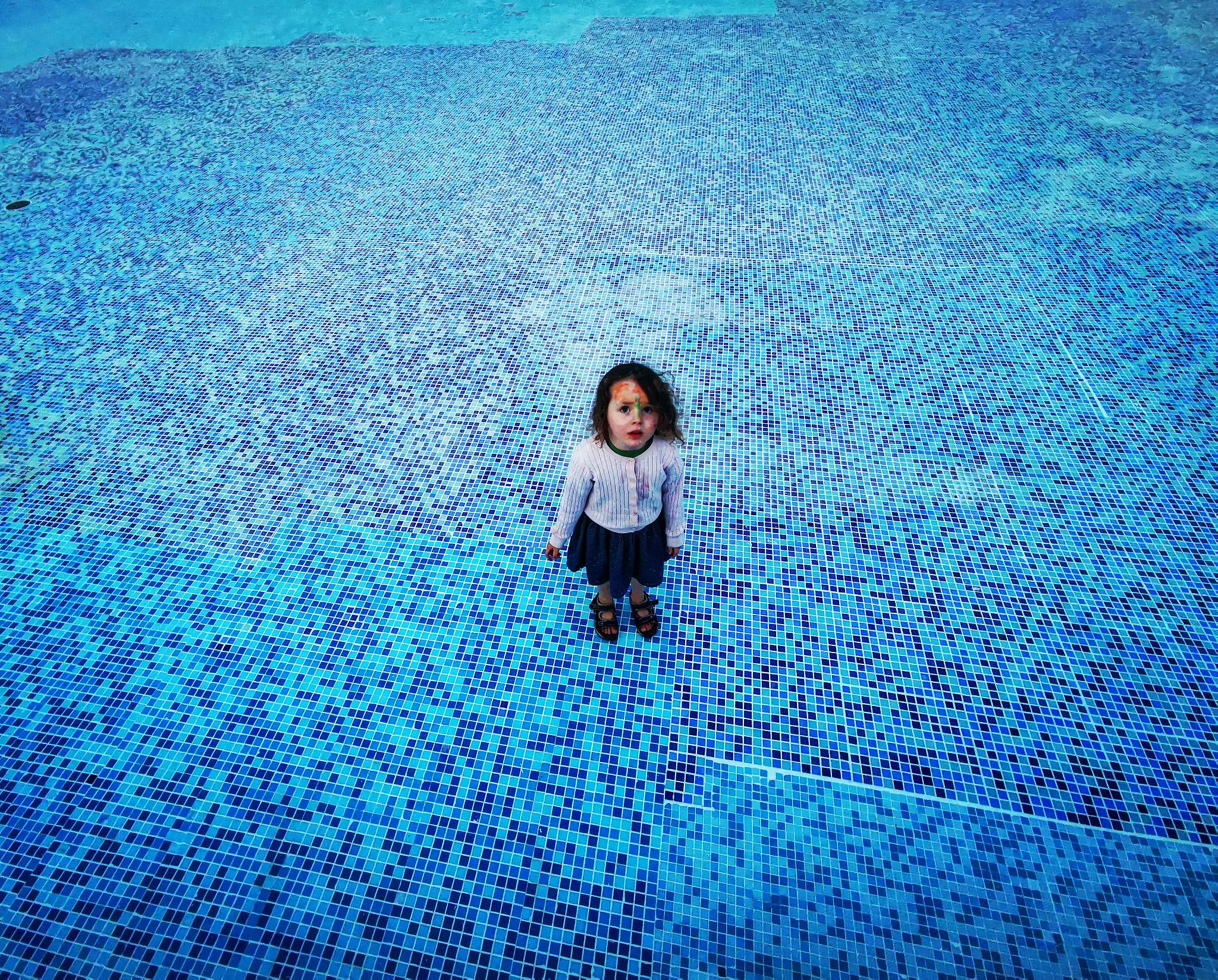 high angle view of woman standing in swimming pool