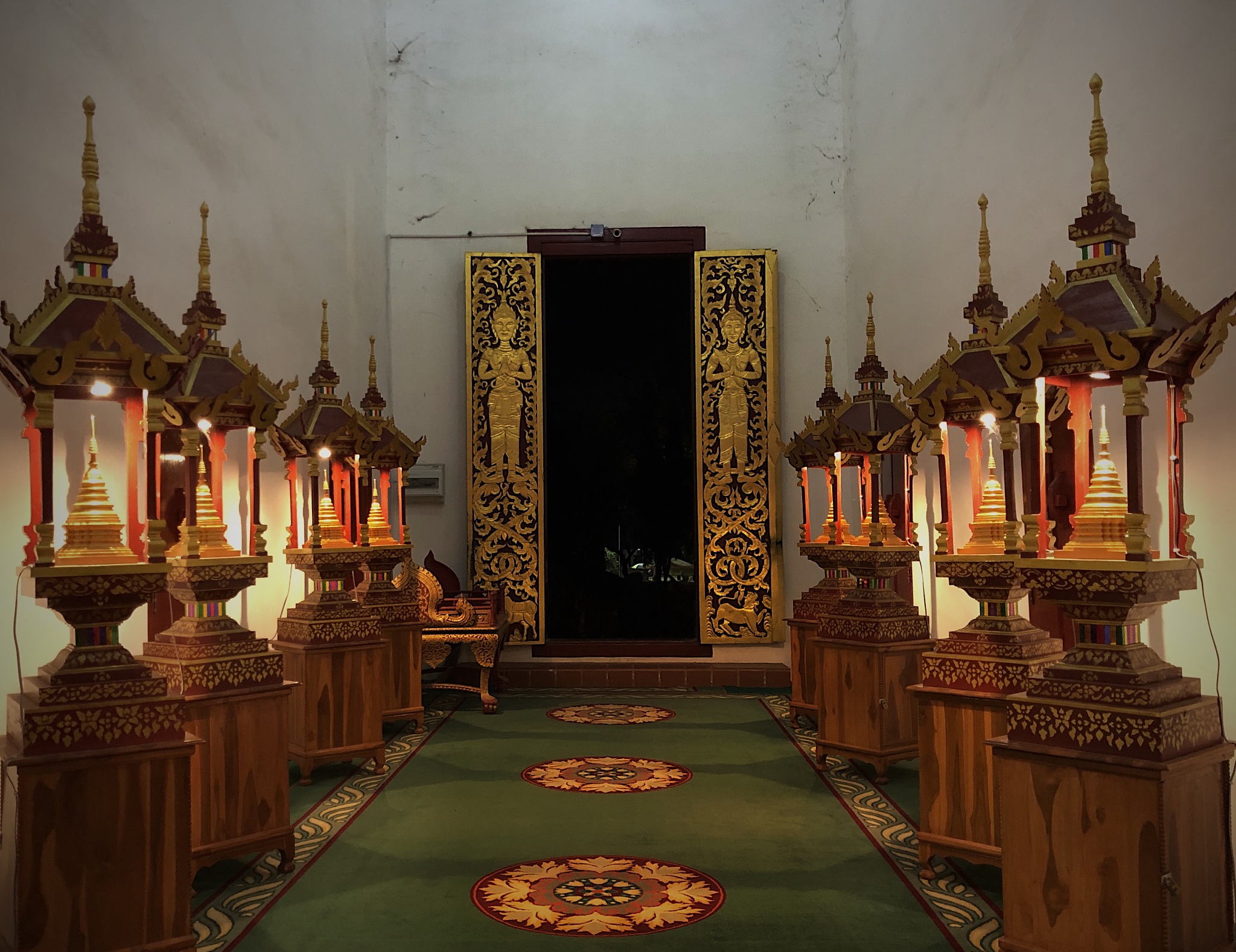 standing antiue buddha image in the hall of thai temple, wat cha