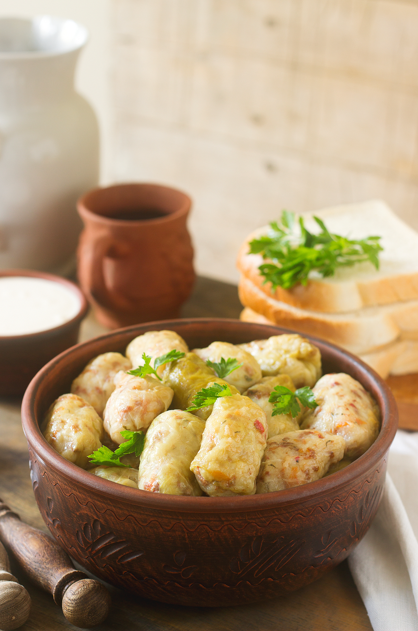 cabbage rolls served with sour cream, bread and wine. dolma, sar