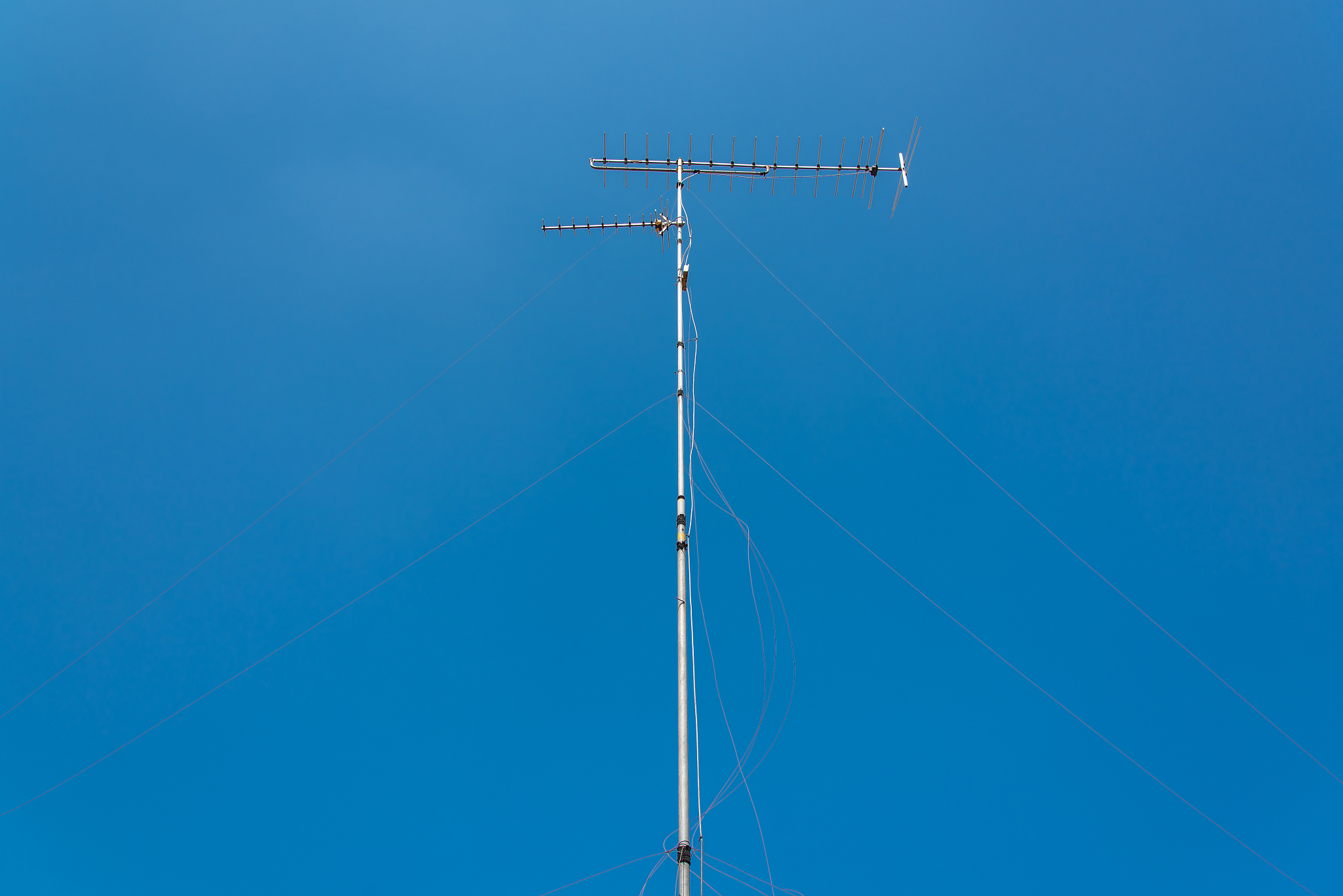 television antenna with blue sky in bangkok, thailand.