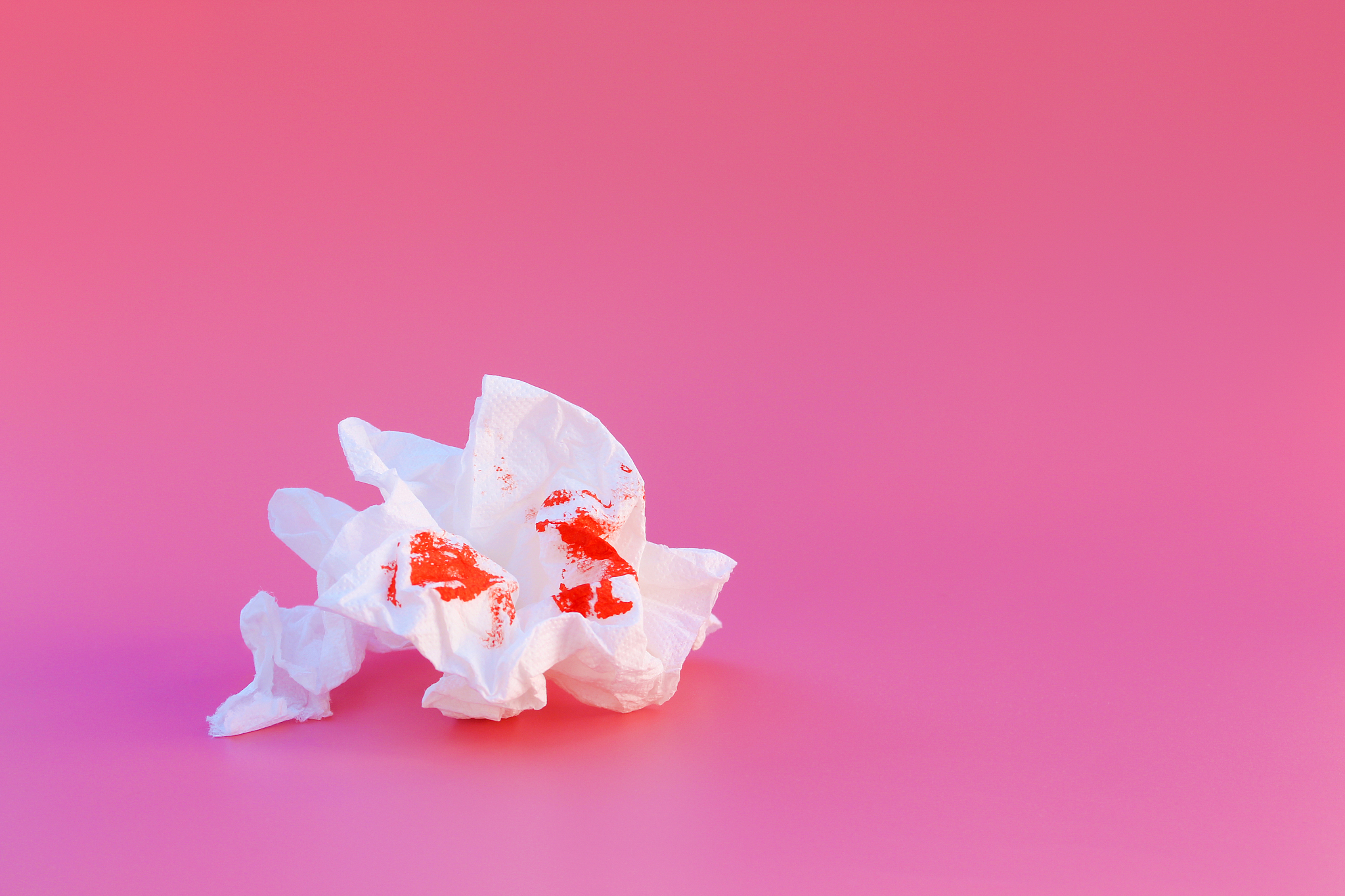 toilet paper and blood. concept of hemorrhoid treatment.