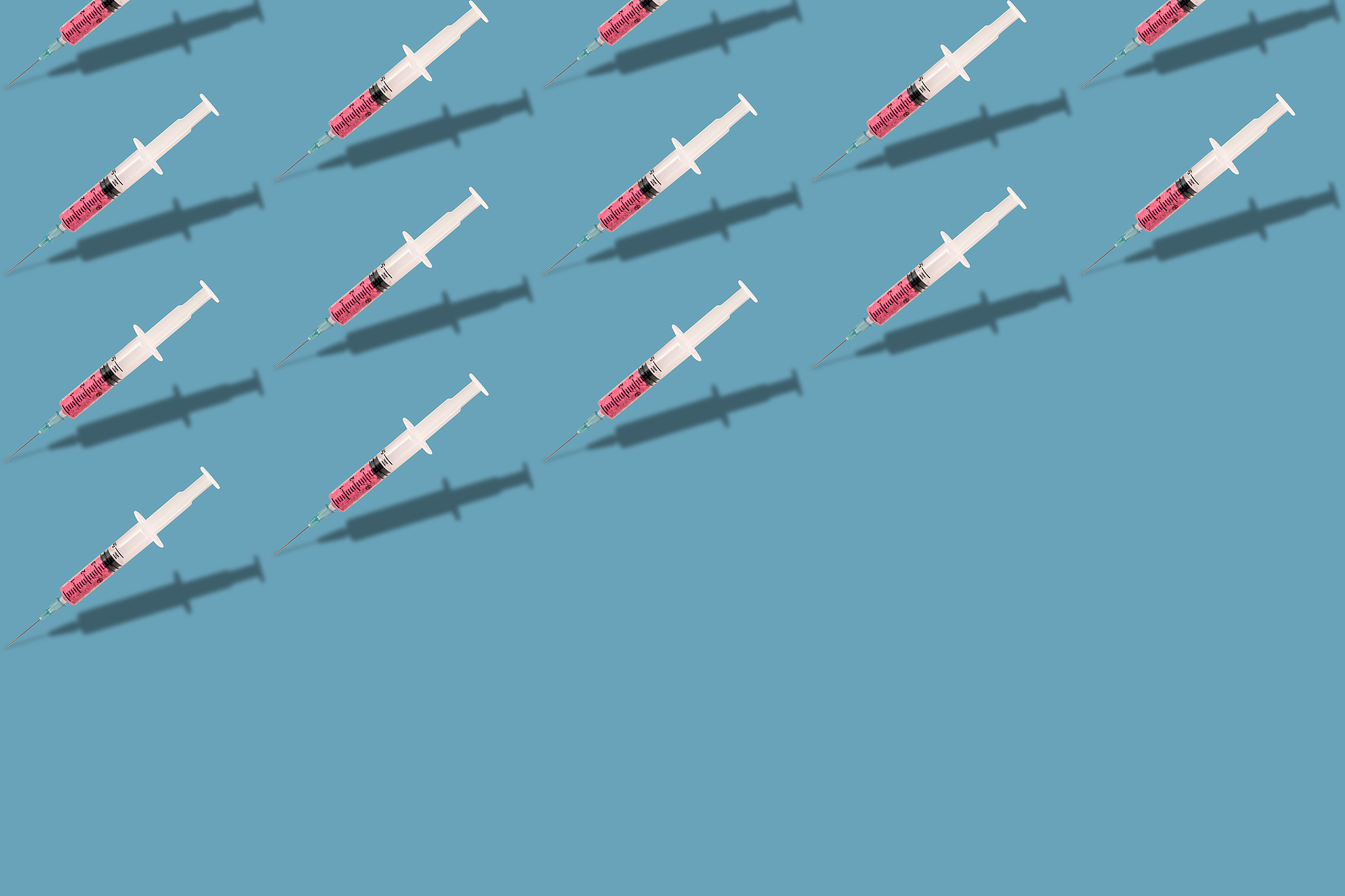 beautiful creative pattern syringe medical on a blue background.