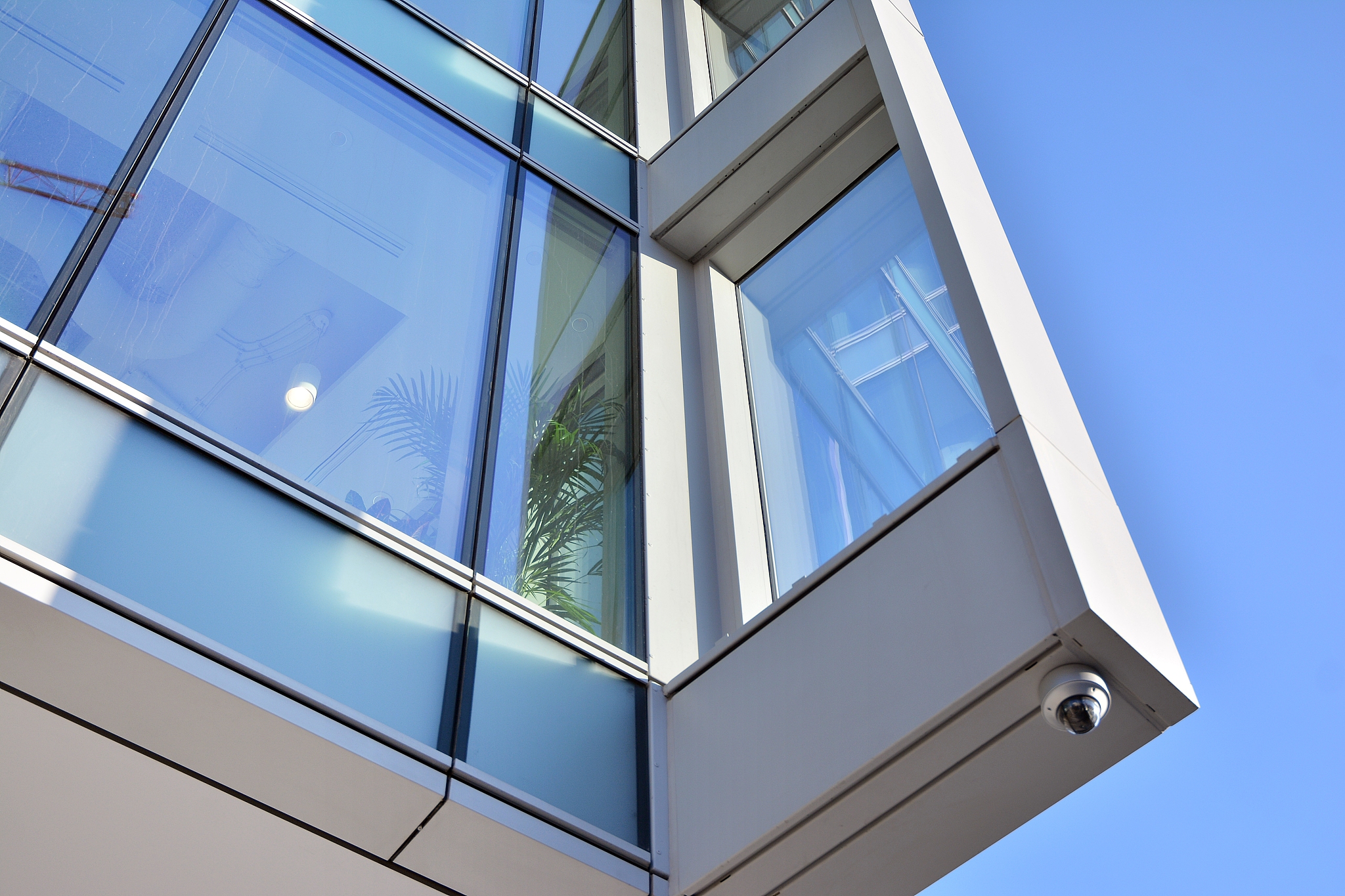 modern office building detail, glass surface with sunlight