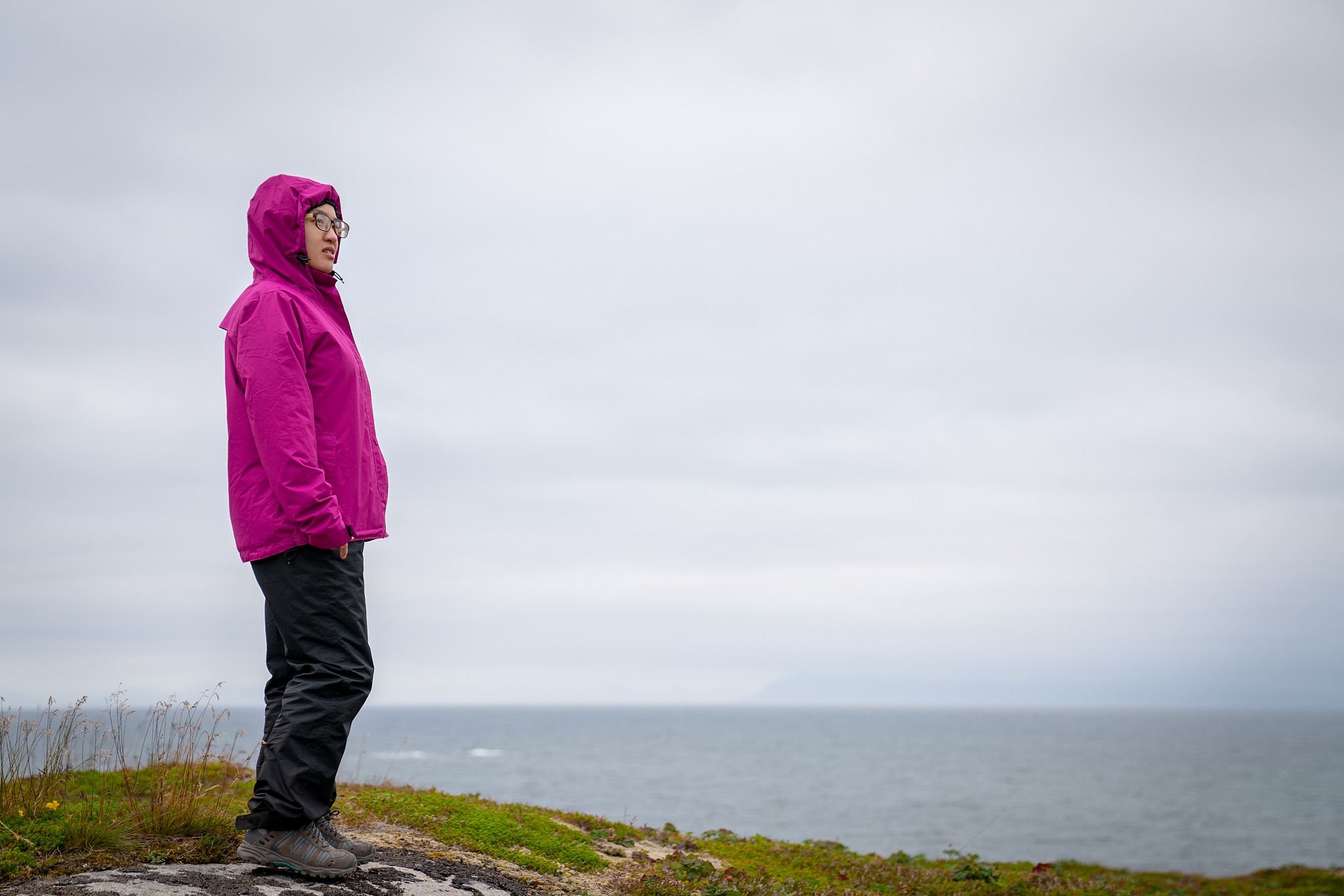 woman standing on a summit in gimsy, norway