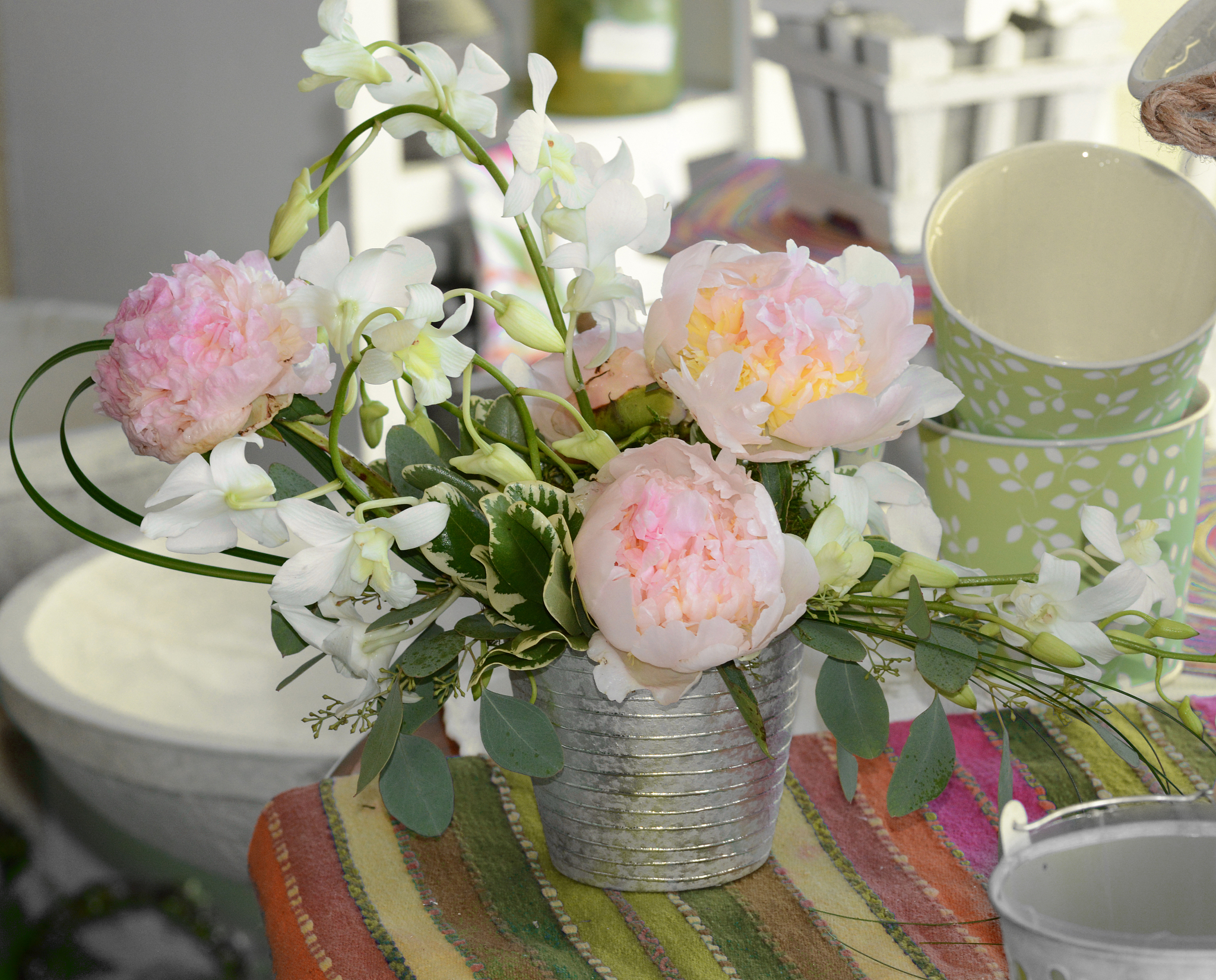 floral arrangement of peonies and orchids