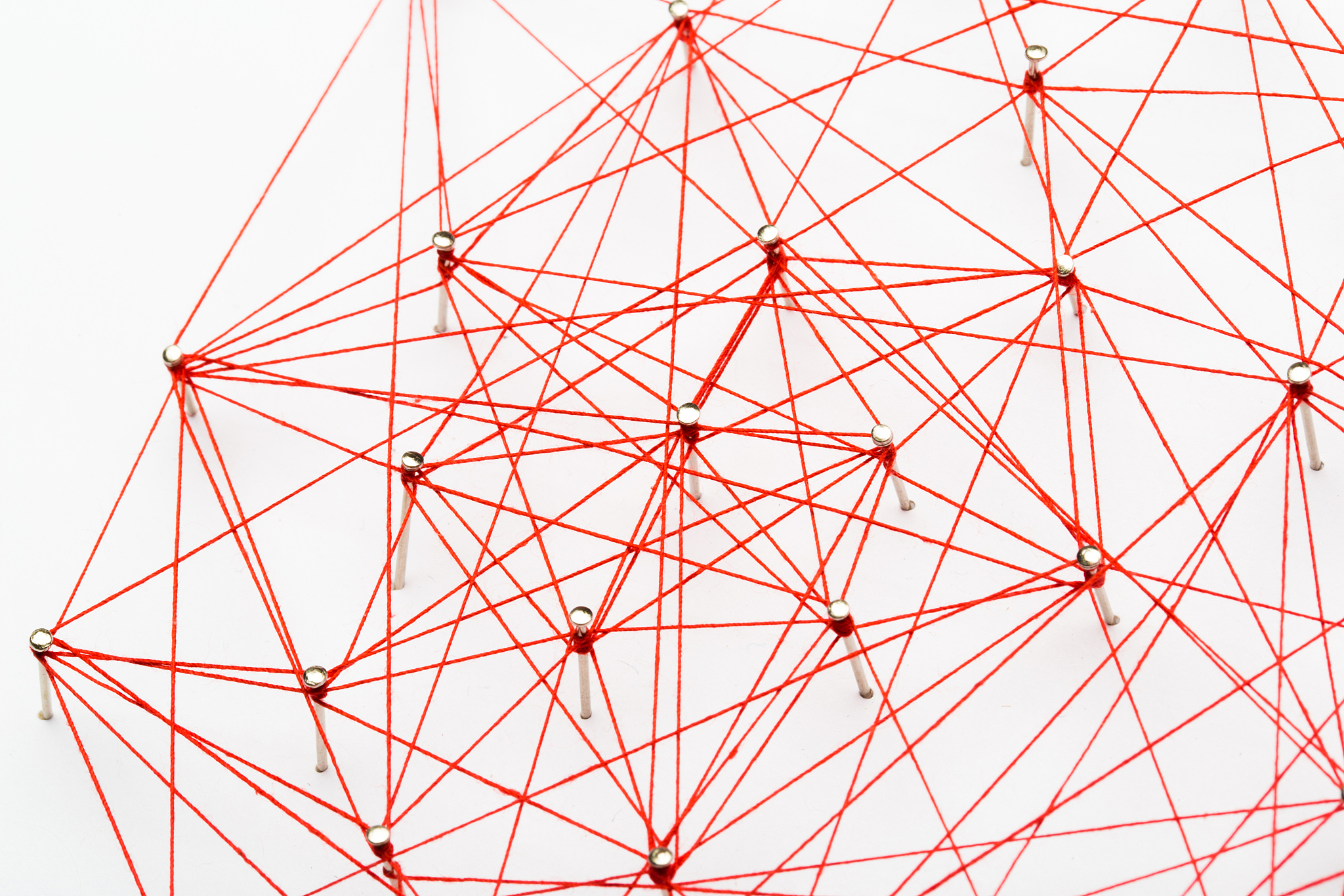 a large grid of pins connected with string. communication, netwo