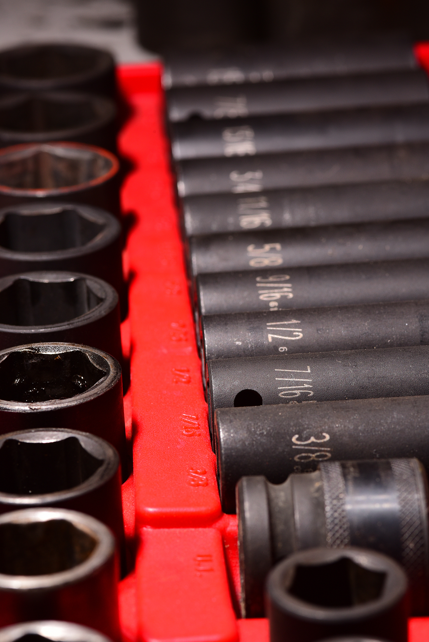 low angle close up of impact tool socket set with imperial measu