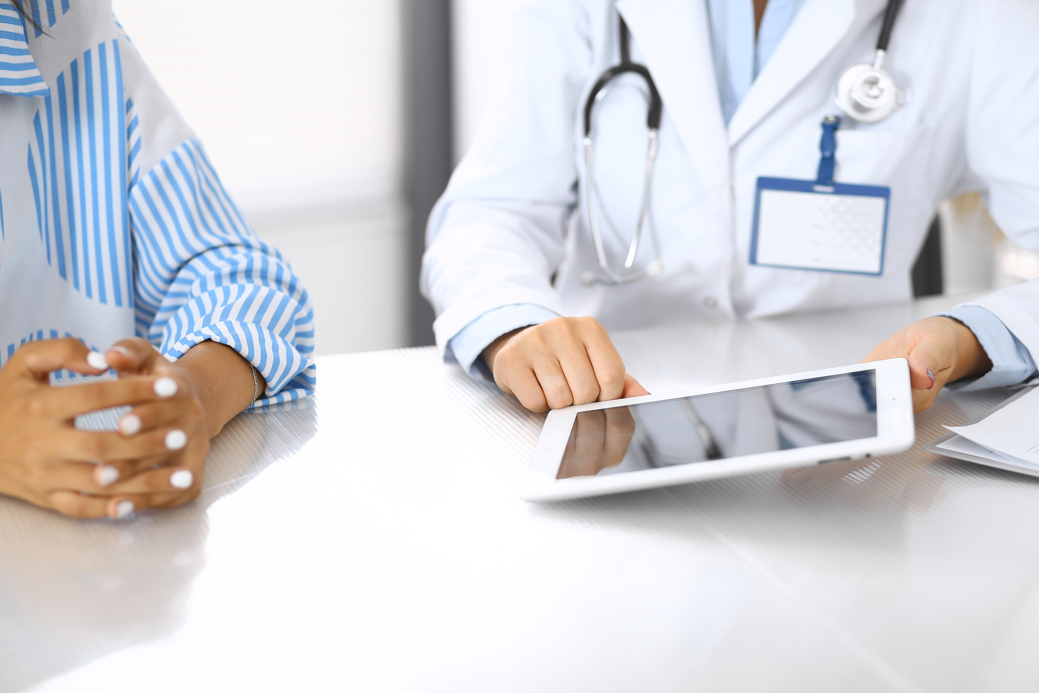 doctor and  patient talking and discussing health treatment whil