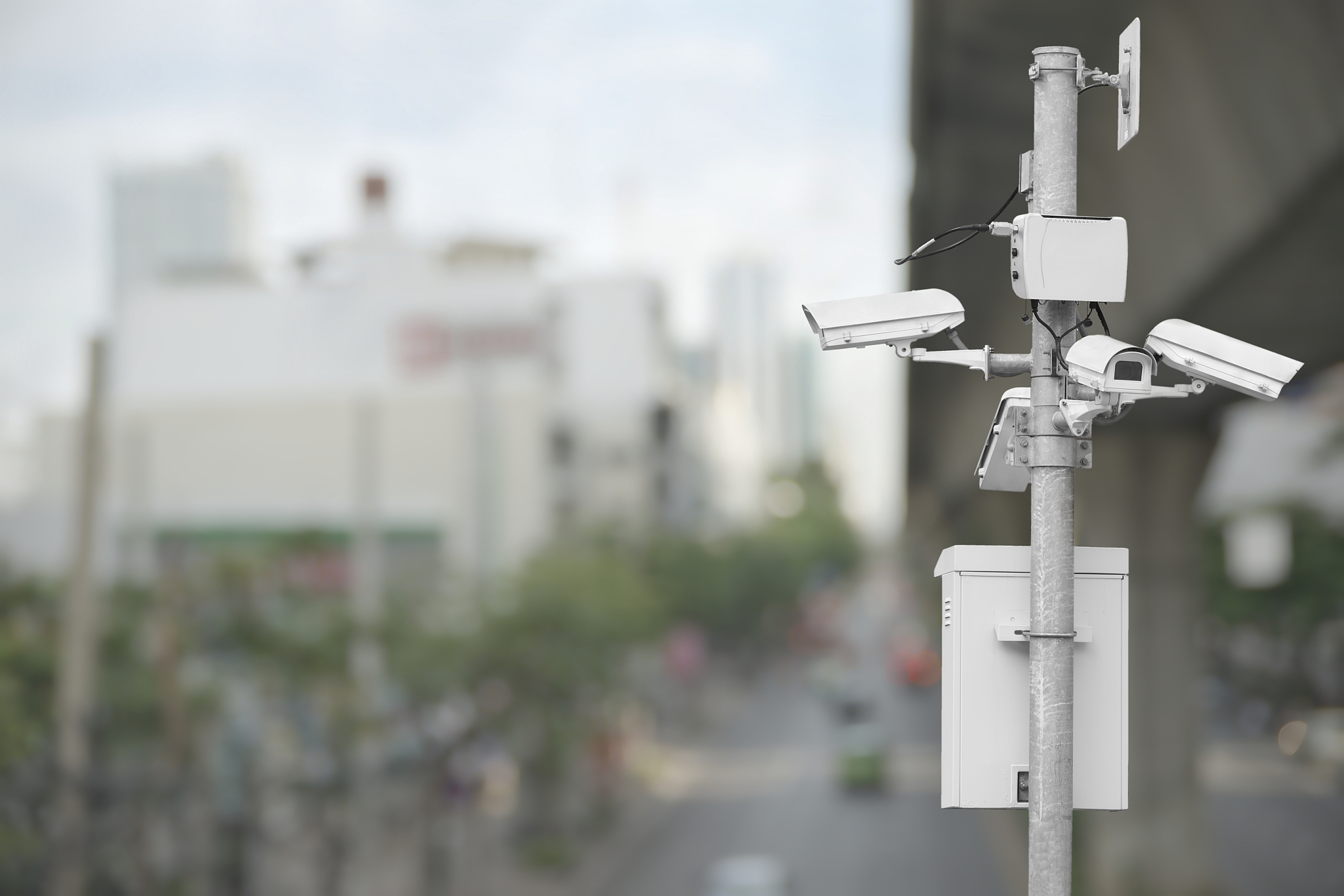 cctv over blurry cityscape